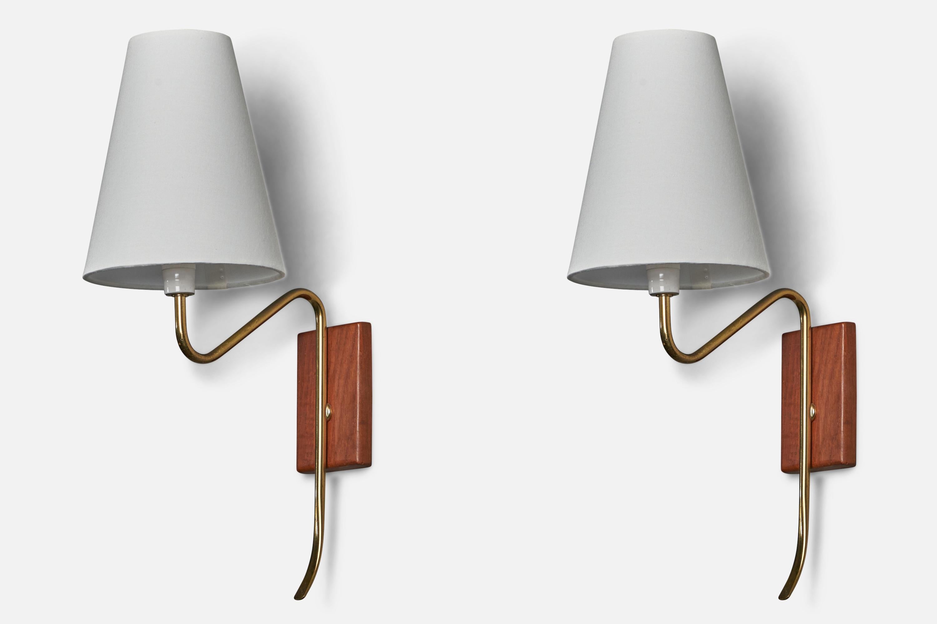 A pair of brass, teak and white fabric wall lights designed and produced in Sweden, 1950s.

Overall Dimensions (inches): 16