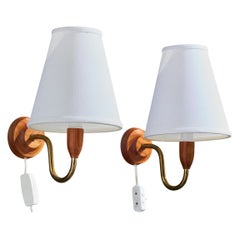 Design svedese, lampade da parete, ottone, teak, tessuto, Svezia, anni '50