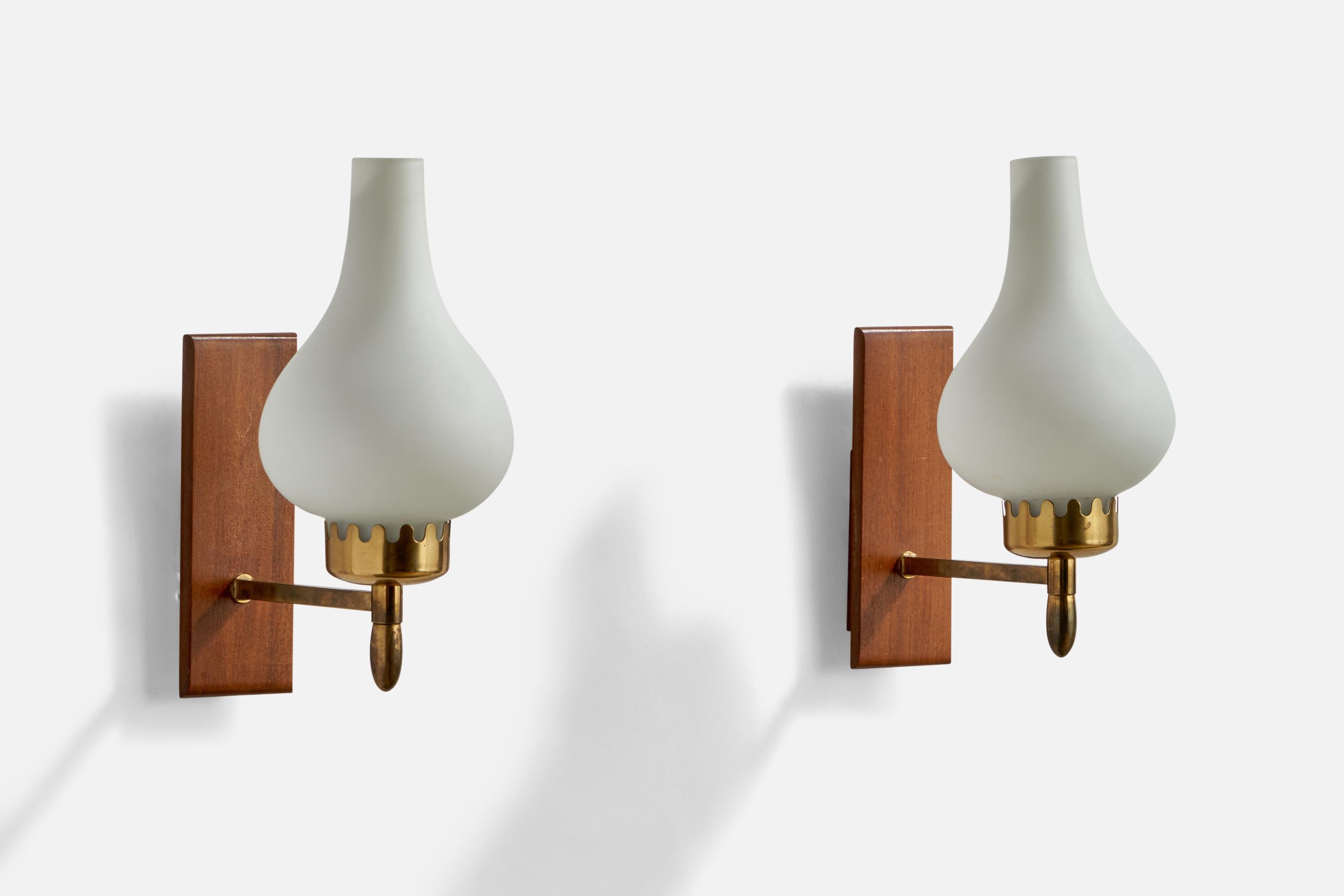 A pair of brass, teak and opaline glass wall lights designed and produced in Sweden, 1940s.

Overall Dimensions (inches): 9” H x 4” W x 6.75” D
Back Plate Dimensions (inches): 6” H x 2.1” W x 0.8” D
Bulb Specifications: E-14 Bulbs
Number of Sockets: