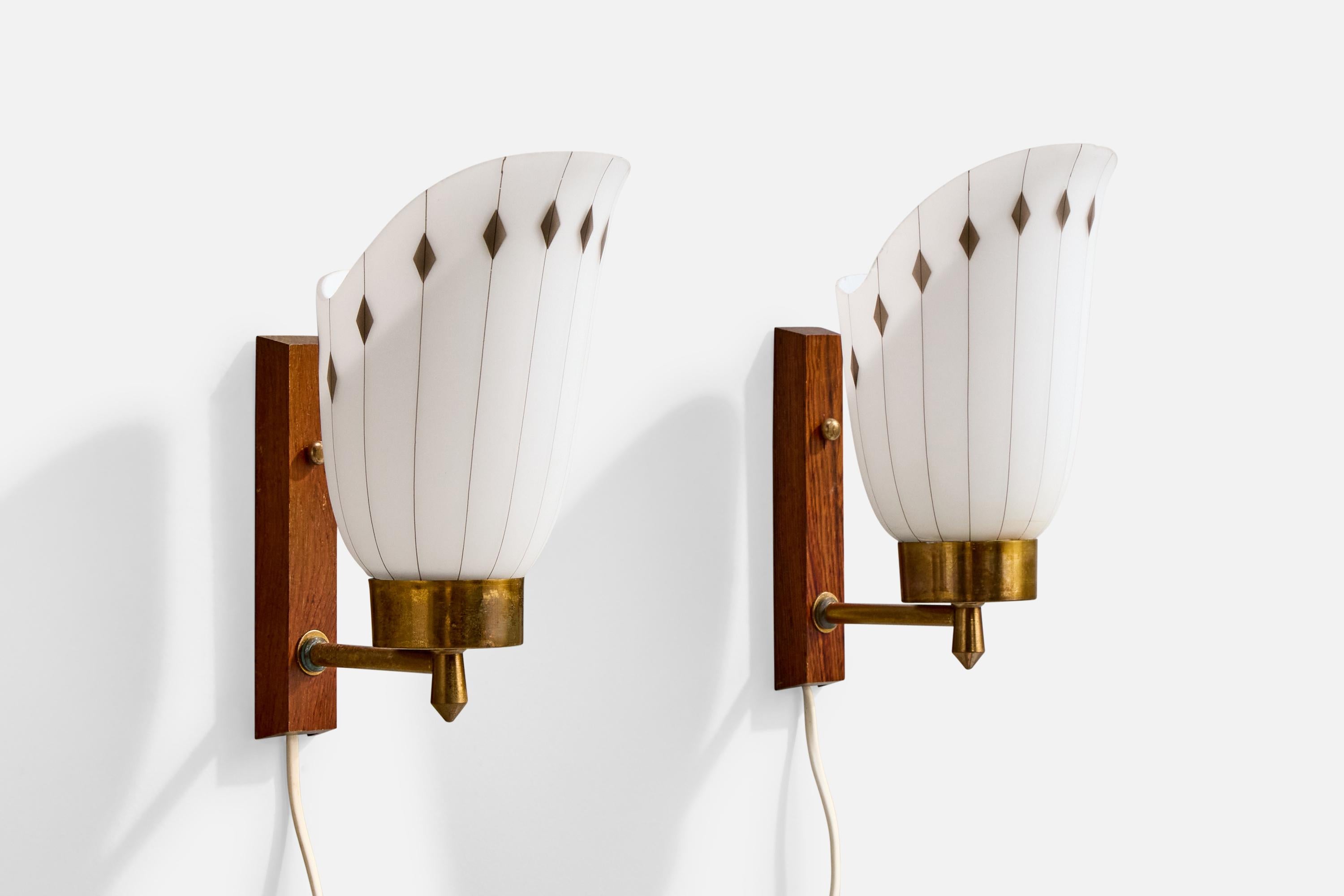 A pair of teak, brass, gold and black-painted white opaline glass wall lights designed and produced in Sweden, c. 1950s.

Oxidation present to brass

Wear consistent with age and use

Overall Dimensions (Inches): 9.25