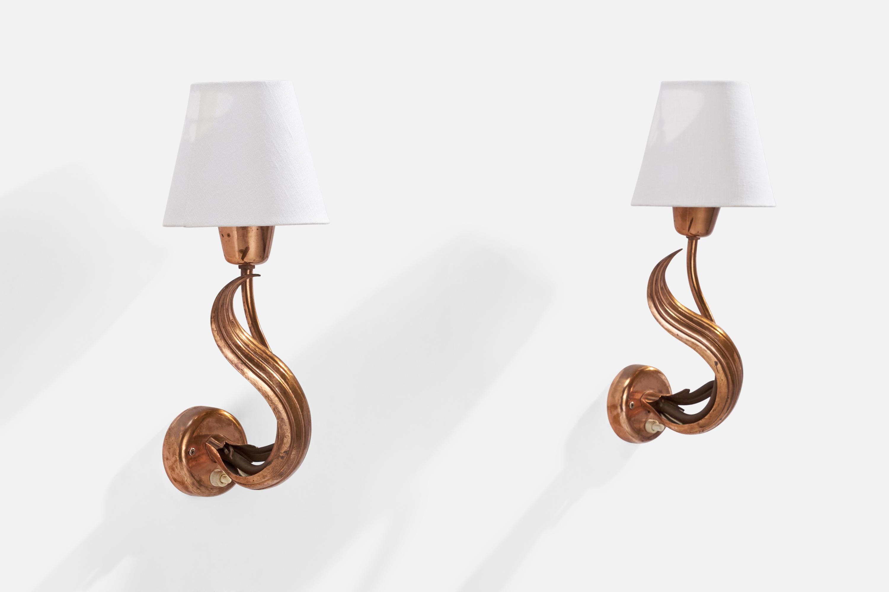 A pair of copper and white fabric wall lights designed and produced in Sweden, 1940s.

Overall Dimensions (inches): 10.5” H x 4.25”  W x 5” D
Back Plate Dimensions (inches): 2.75”  H x 2.75”  W x .75” D
Bulb Specifications: E-14 Bulb
Number of