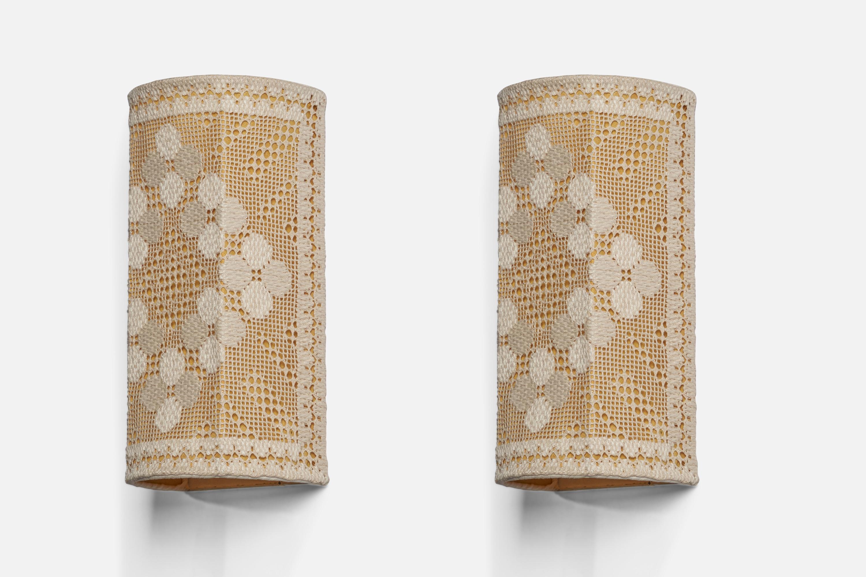 A pair of embroidery fabric wall lights designed and produced in Sweden, 1940s.

Overall Dimensions (inches): 11.5” H x 5.75” W x 3.6” D
Bulb Specifications: E-14
Number of Sockets: 1