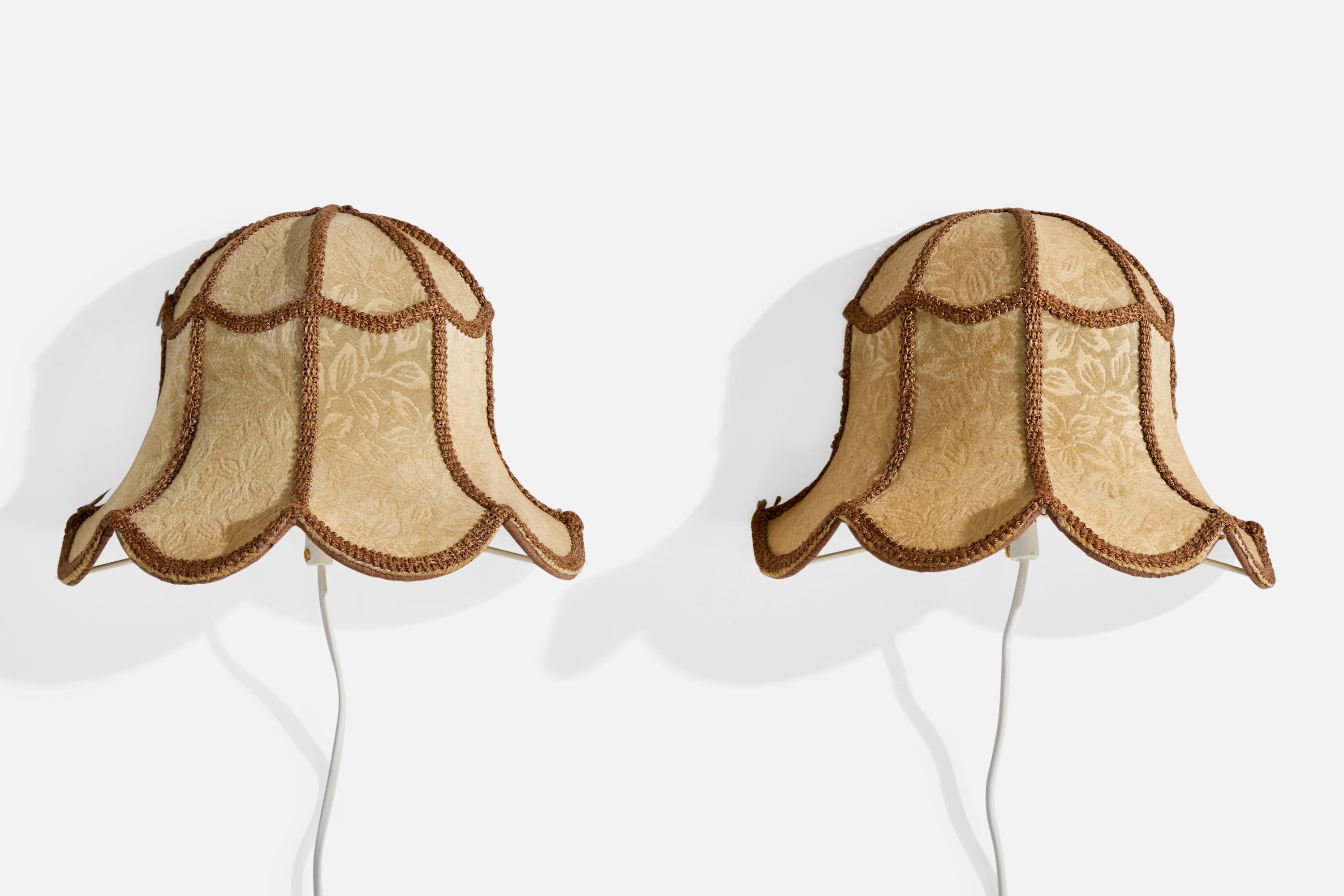 A pair of beige and brown fabric wall lights designed and produced in Sweden, c. 1960s.

Overall Dimensions (Inches): 8.0
