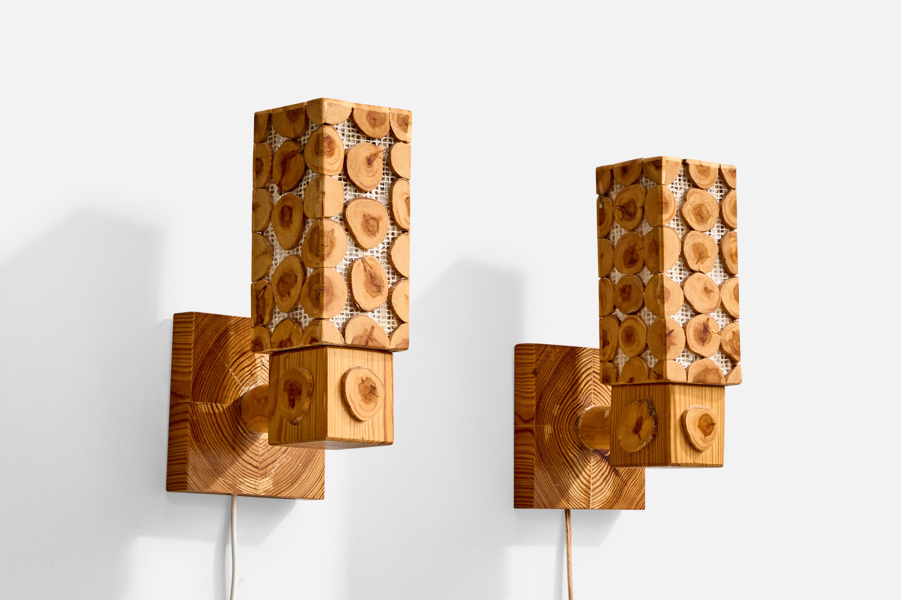 A pair of pine and raffia wall lights designed and produced in Sweden, c. 1970s.

Overall Dimensions (Inches): 9.0