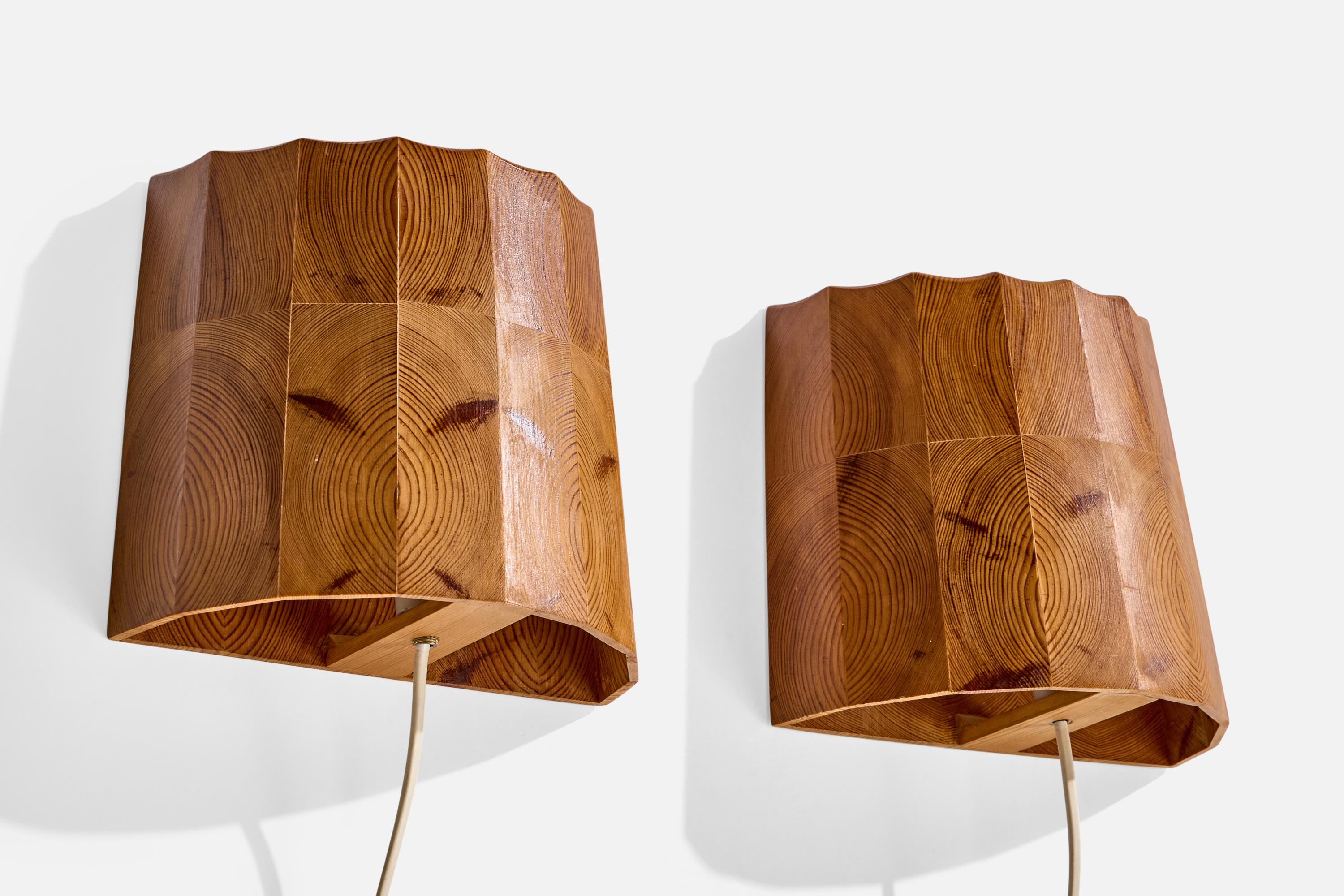 A pair of pine wall lights designed and produced in Sweden, c. 1970s.

Wear consistent with age and use

Overall Dimensions (Inches): 7.5