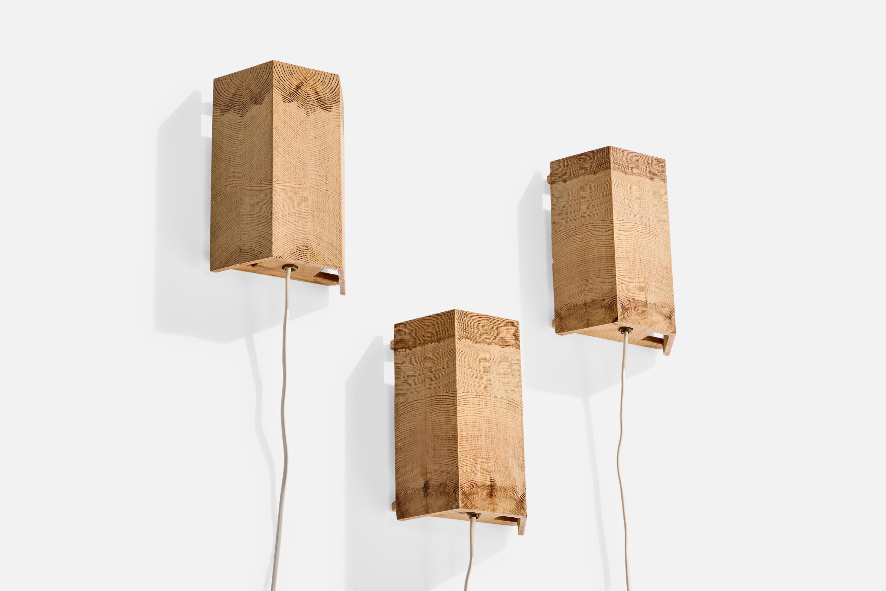 A set of three pine wall lights designed and produced in Sweden, c. 1970s.

Wear consistent with age and use

Overall Dimensions (Inches): 8.0