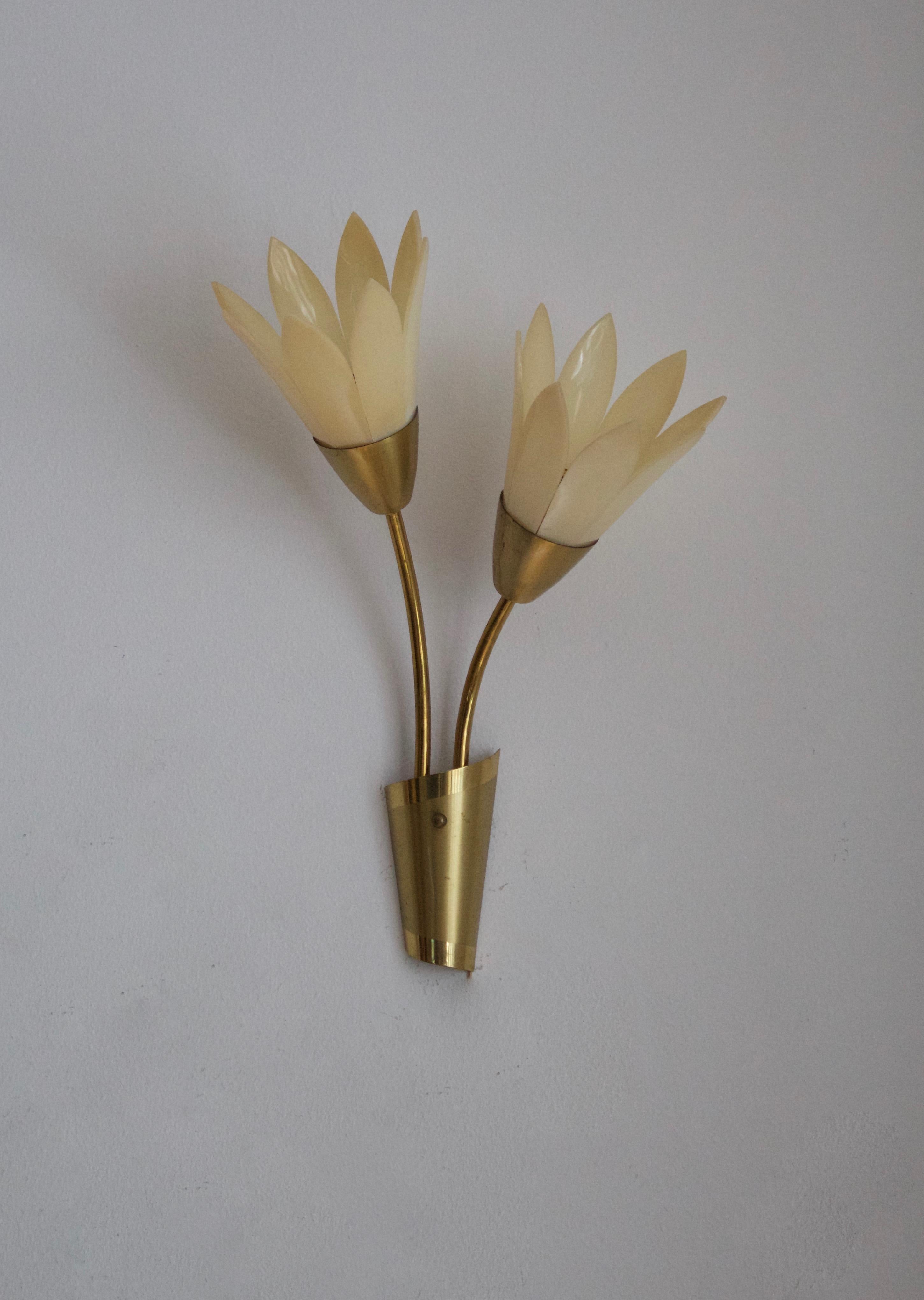 A pair of wall lights / Sconces. Designed and produced in Sweden, 1950s-1960s.

Other designers of the period include Paavo Tynell, Jean Royère, Hans Bergström, Hans-Agne Jakobsson, and Kaare Klint.