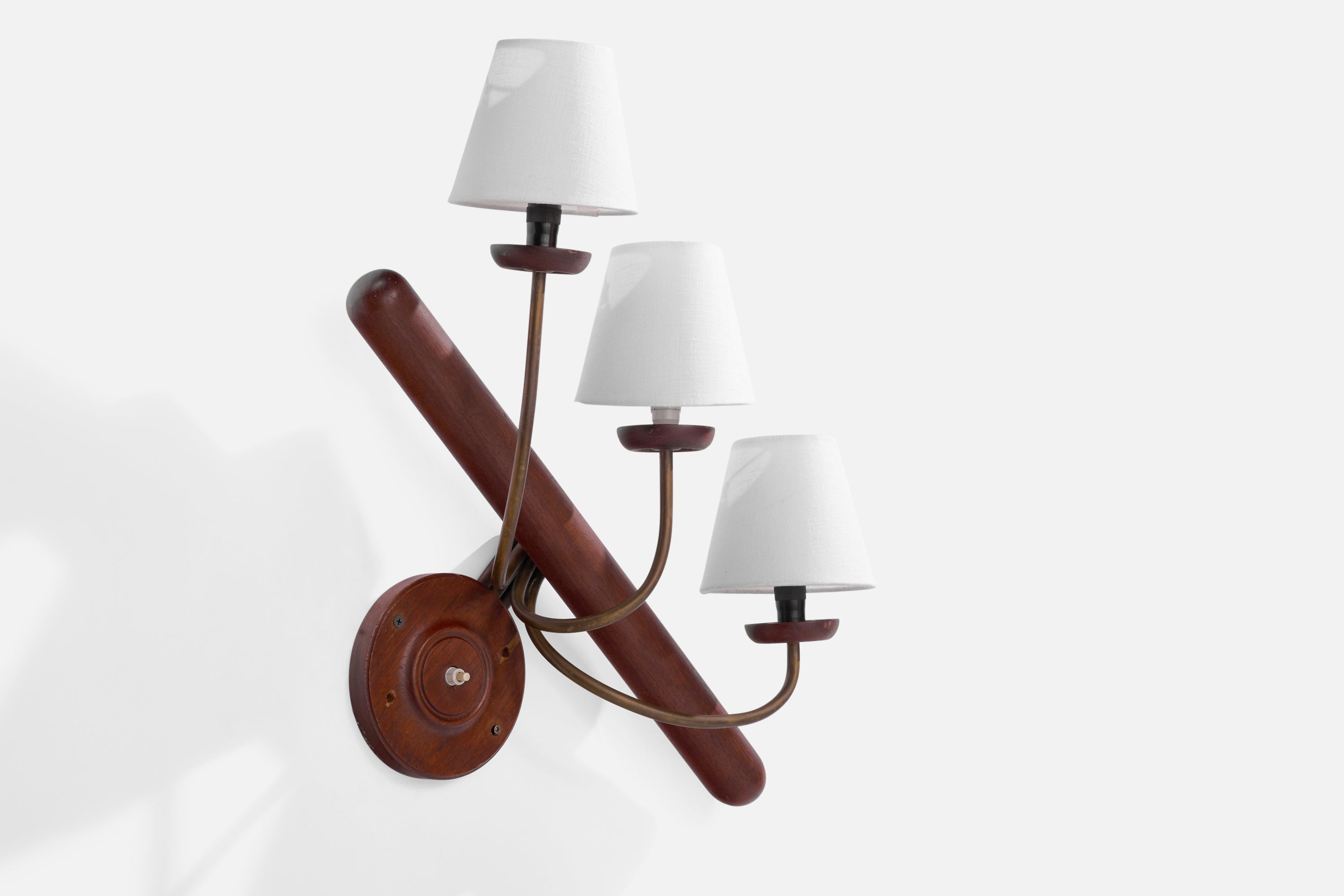 A three-armed brass, teak and white fabric wall light designed and produced in Sweden, 1950s.

Overall Dimensions (inches): 21” H x 19” W x 8.75”  D
Back Plate Dimensions (inches): 5.75”H x 5.75”  W x .75” D
Bulb Specifications: E-14 Bulb
Number of