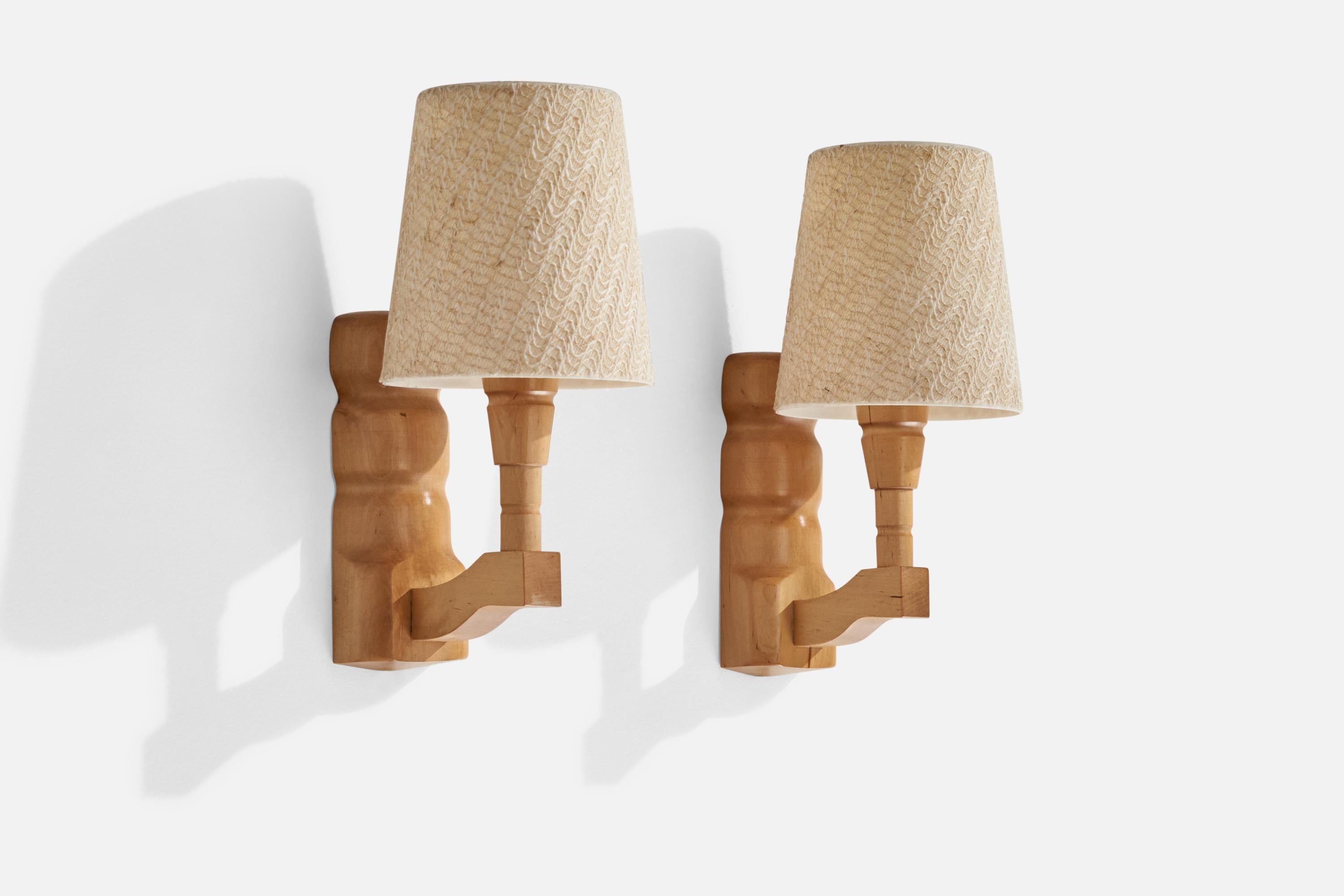 A pair of wood, acrylic and beige fabric wall lights designed and produced in Sweden, dated 1987.

Overall Dimensions (inches): 7.25” H x 5” W x 9.5” D
Back Plate Dimensions (inches): 7” H x 1.47” W x 0.38” D
Bulb Specifications: E-26 Bulb
Number of