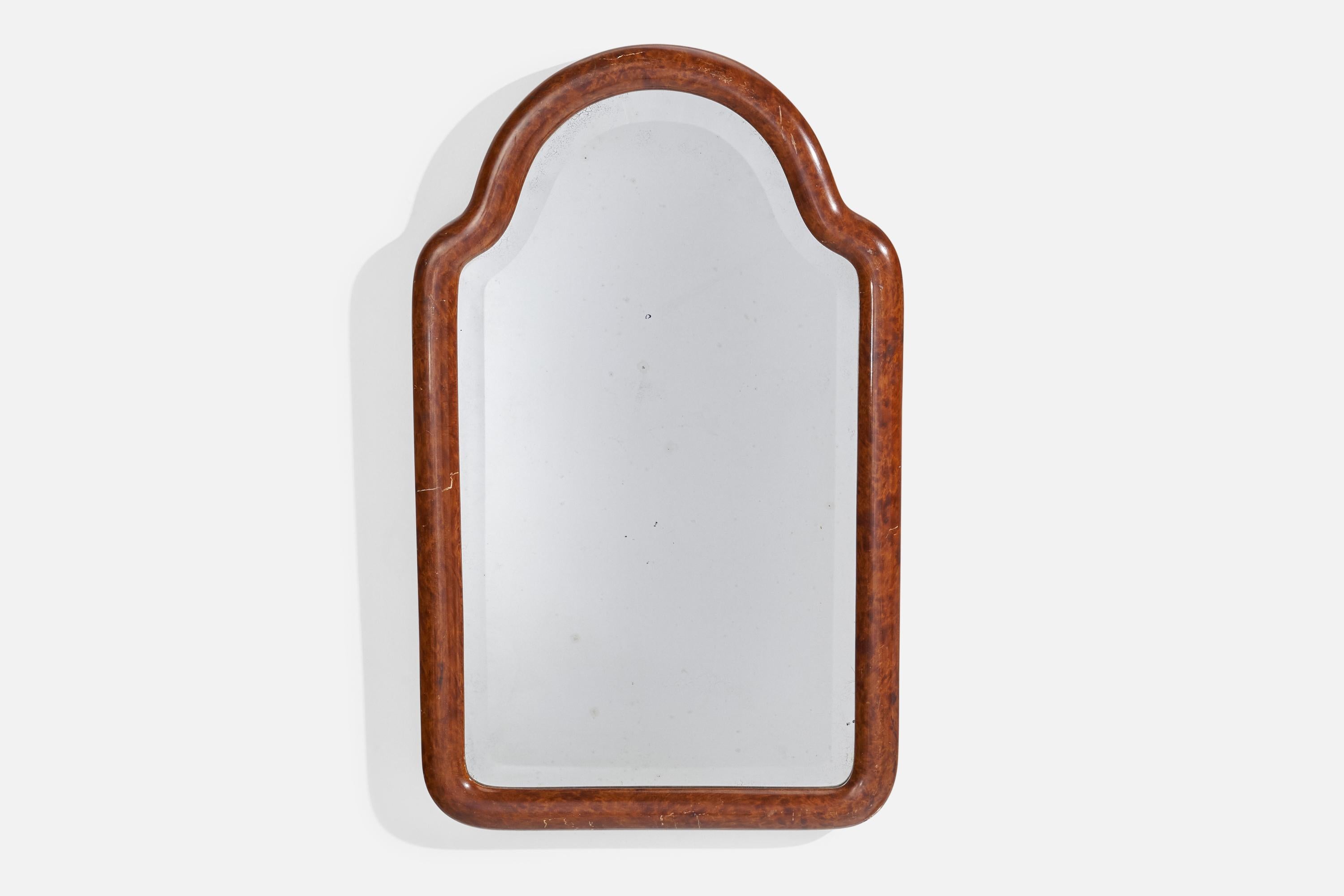A stained birch wall mirror with beveled glass designed and produced in Sweden, 1920s.