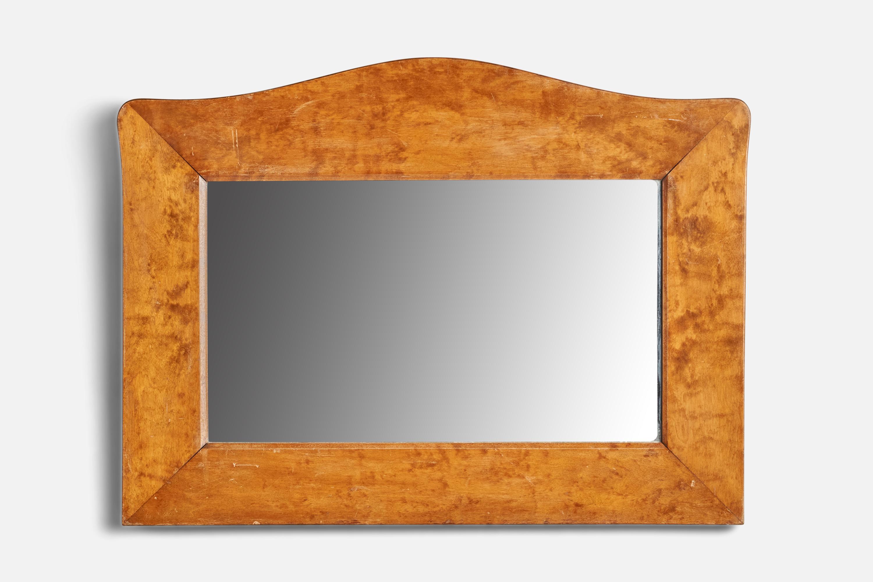 A birch wall mirror designed and produced in Sweden, 1920s.

Has deep scratches in the middle of glass