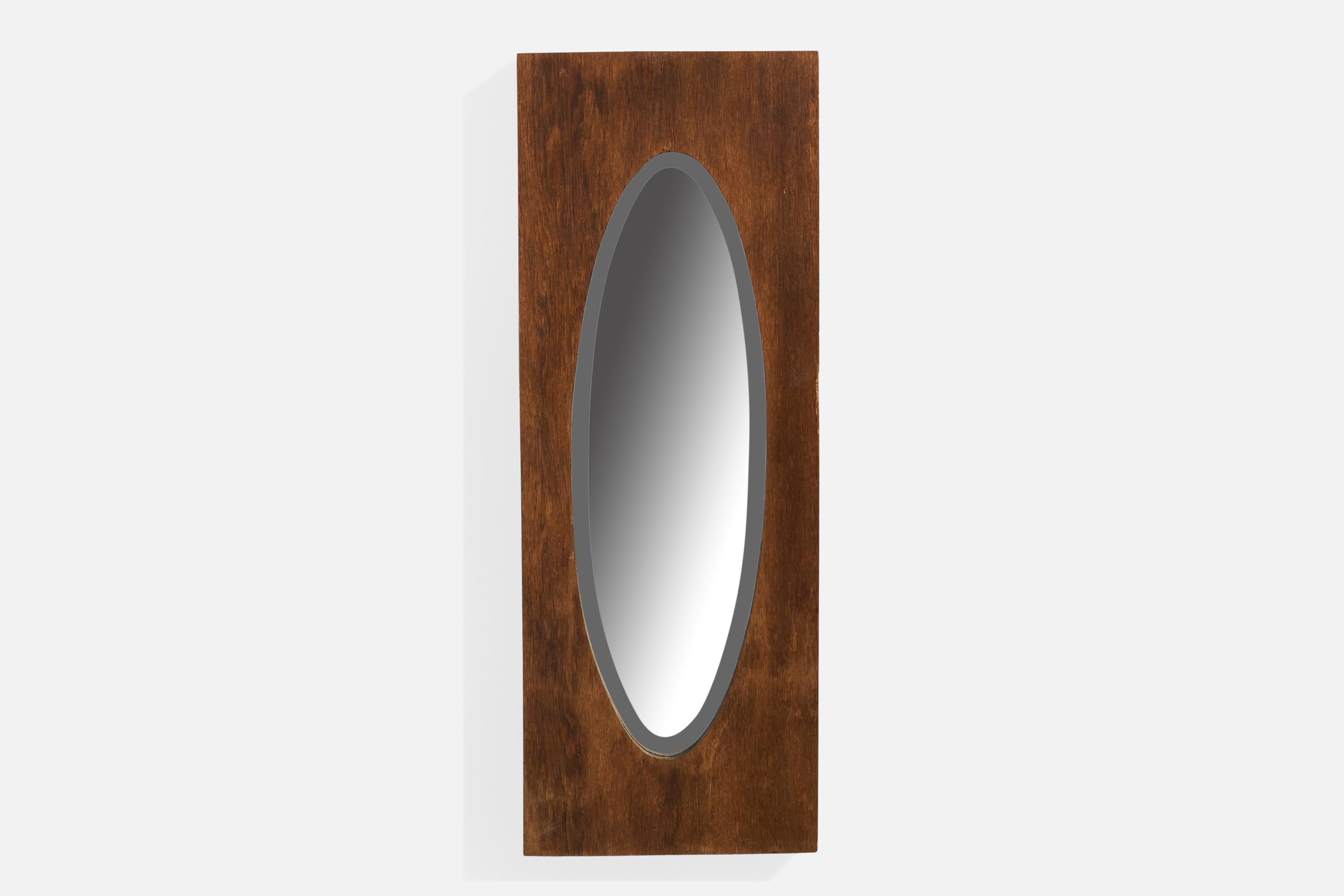 A dark-stained oak wall mirror designed and produced in Sweden, c. 1930s.