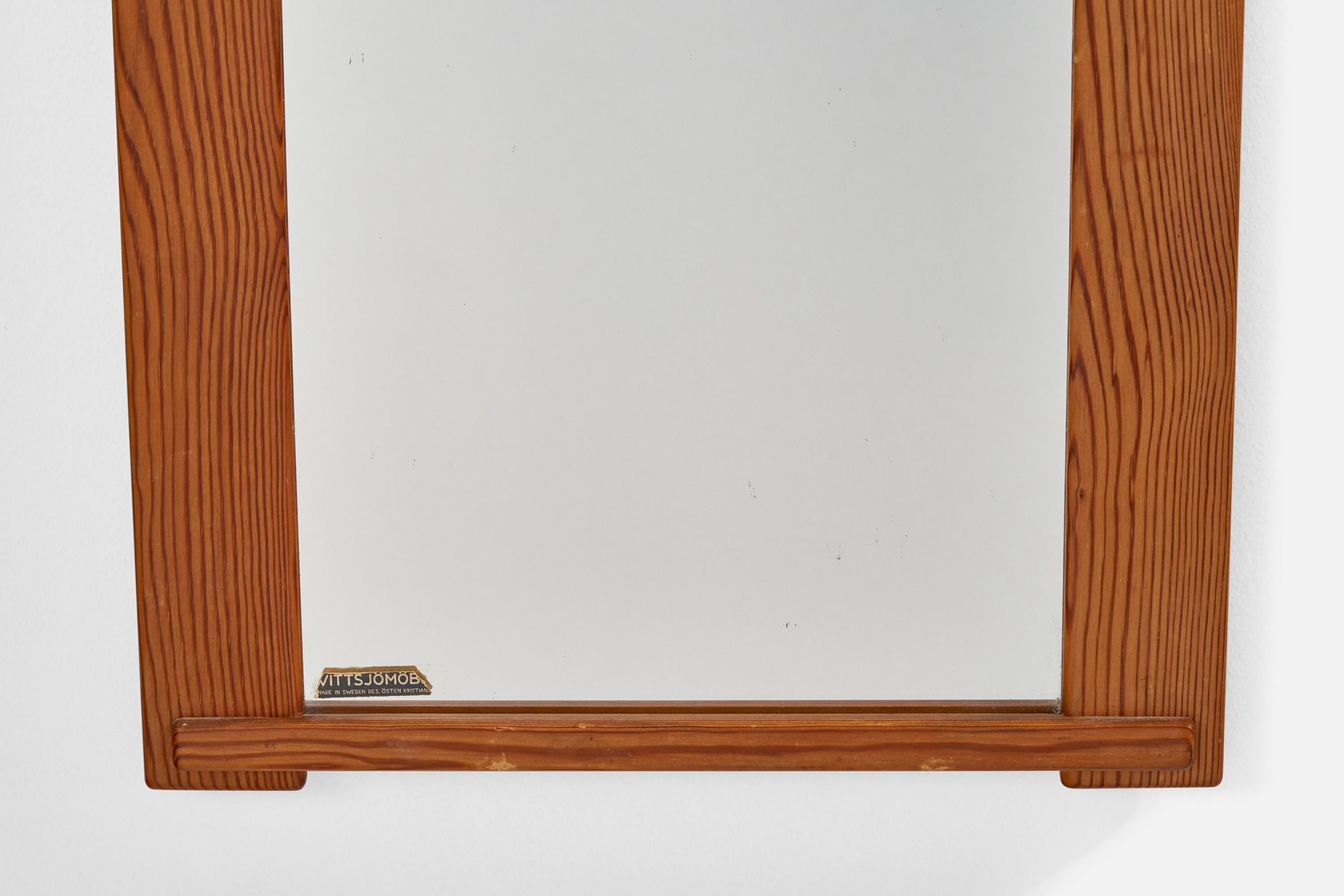 A pine wall mirror designed and produced in Sweden, 1970s.
   