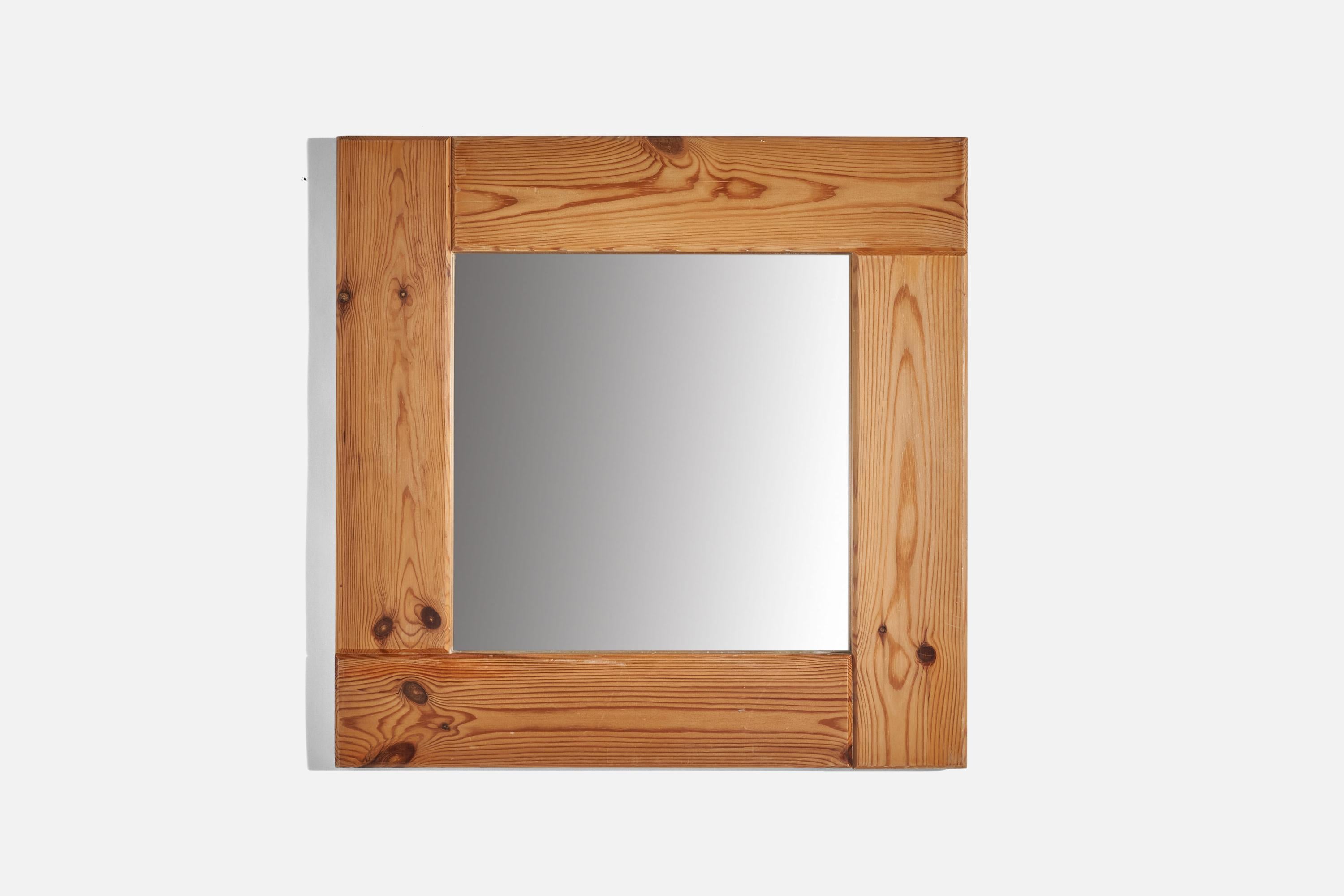 A pine wall mirror designed and produced in Sweden, 1970s.
 