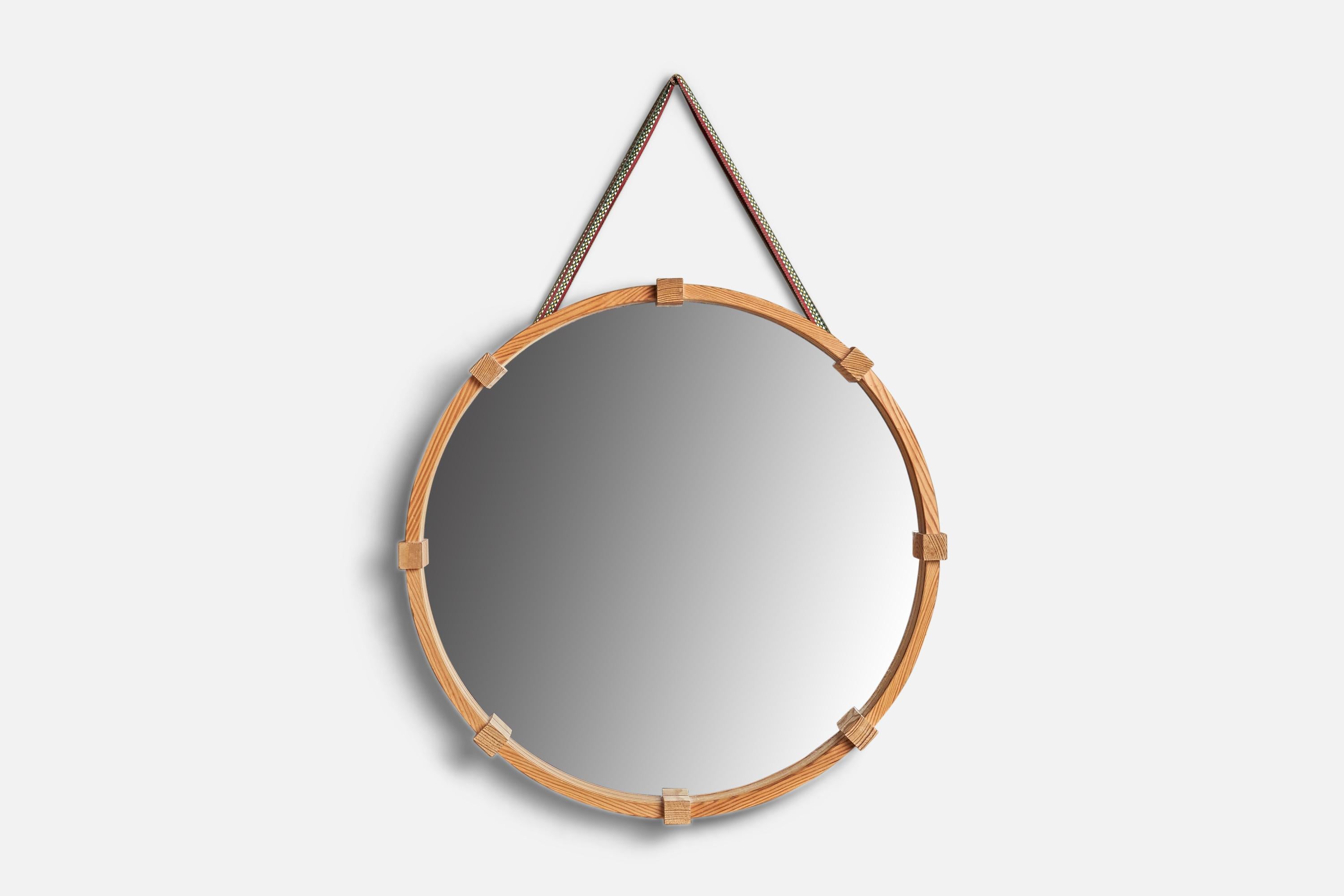A pine wall mirror designed and produced in Sweden, c. 1970s.