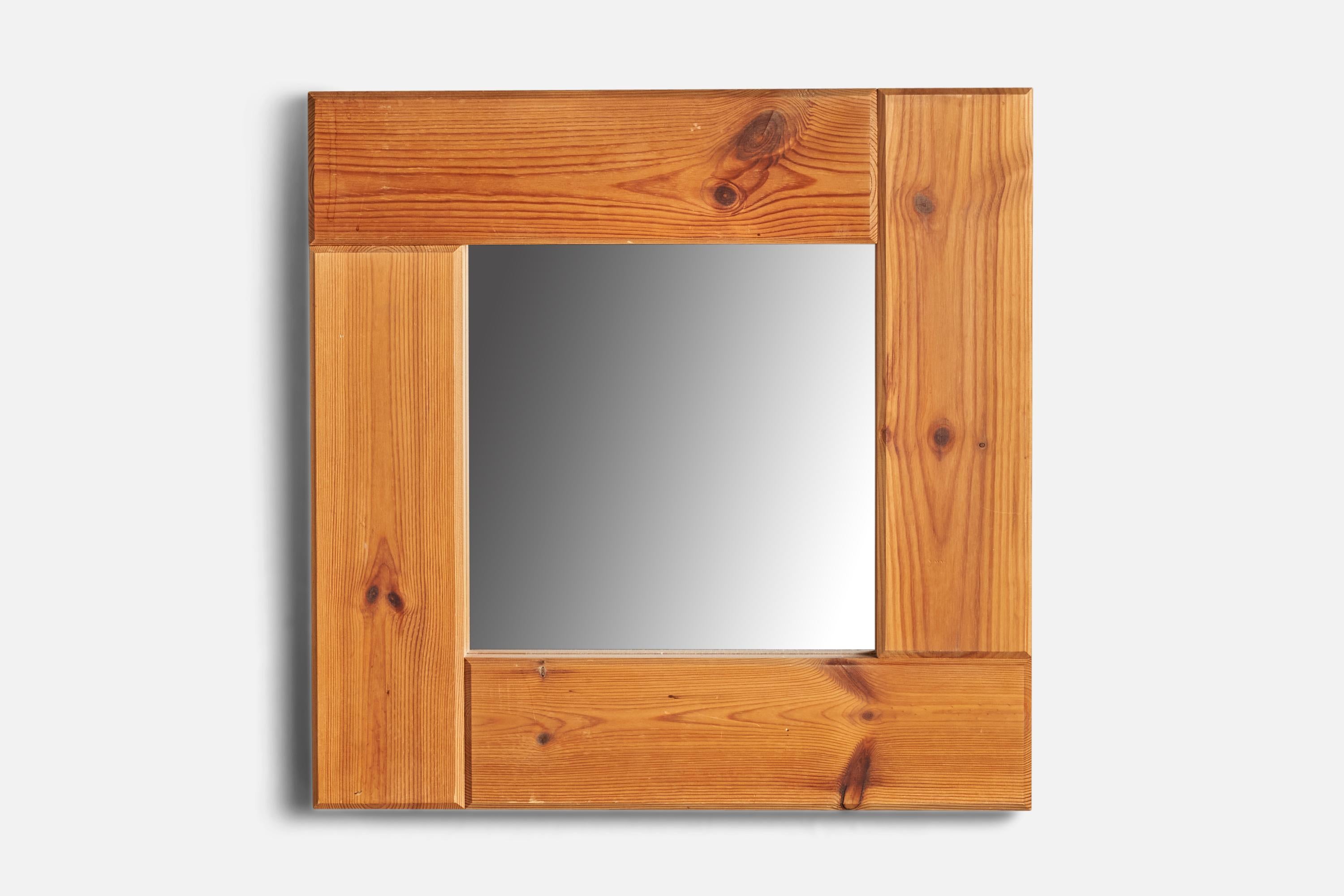 A pine wall mirror designed and produced in Sweden, 1970s.