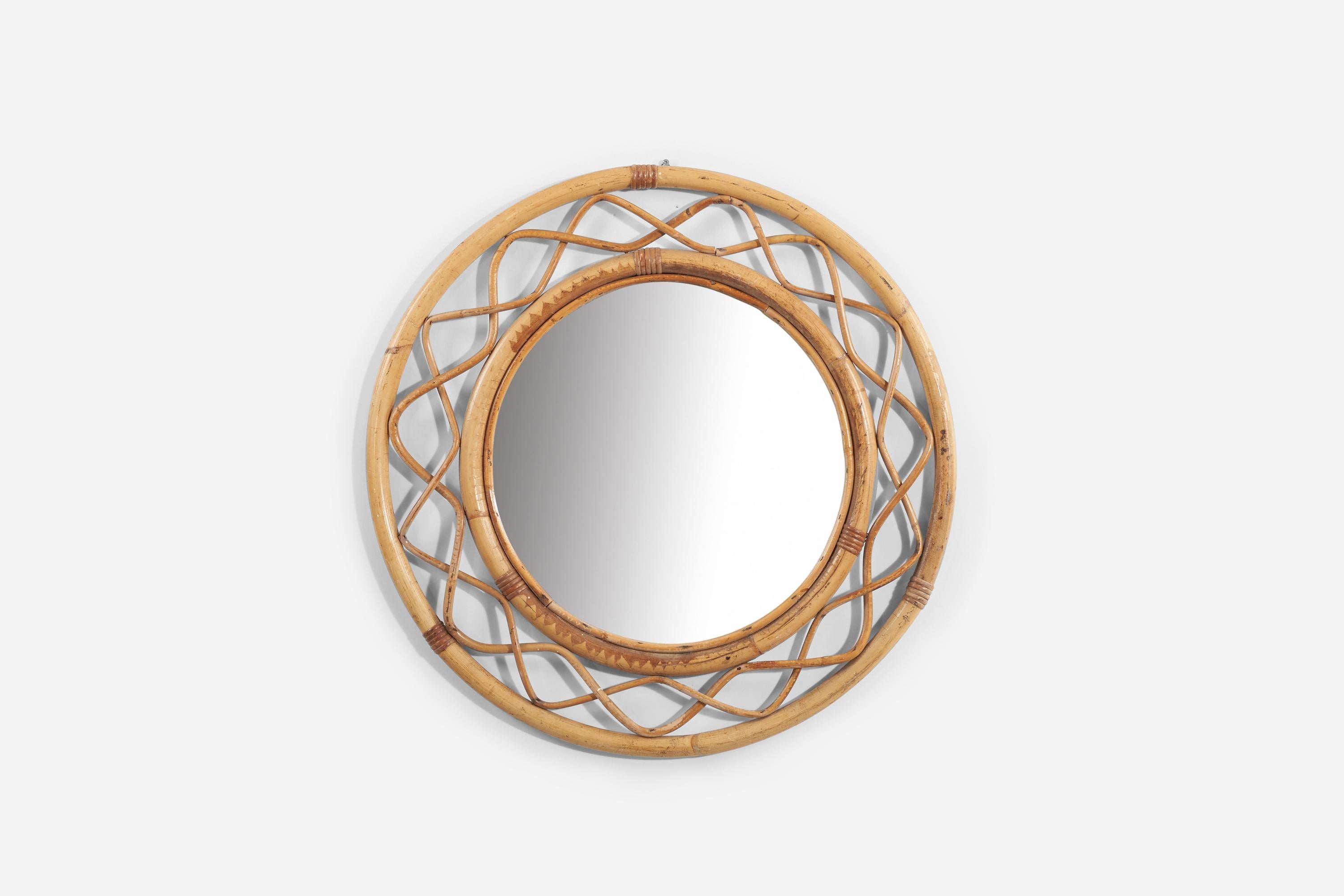 A bamboo and rattan wall mirror produced in Sweden, 1950s-1960s. 

 