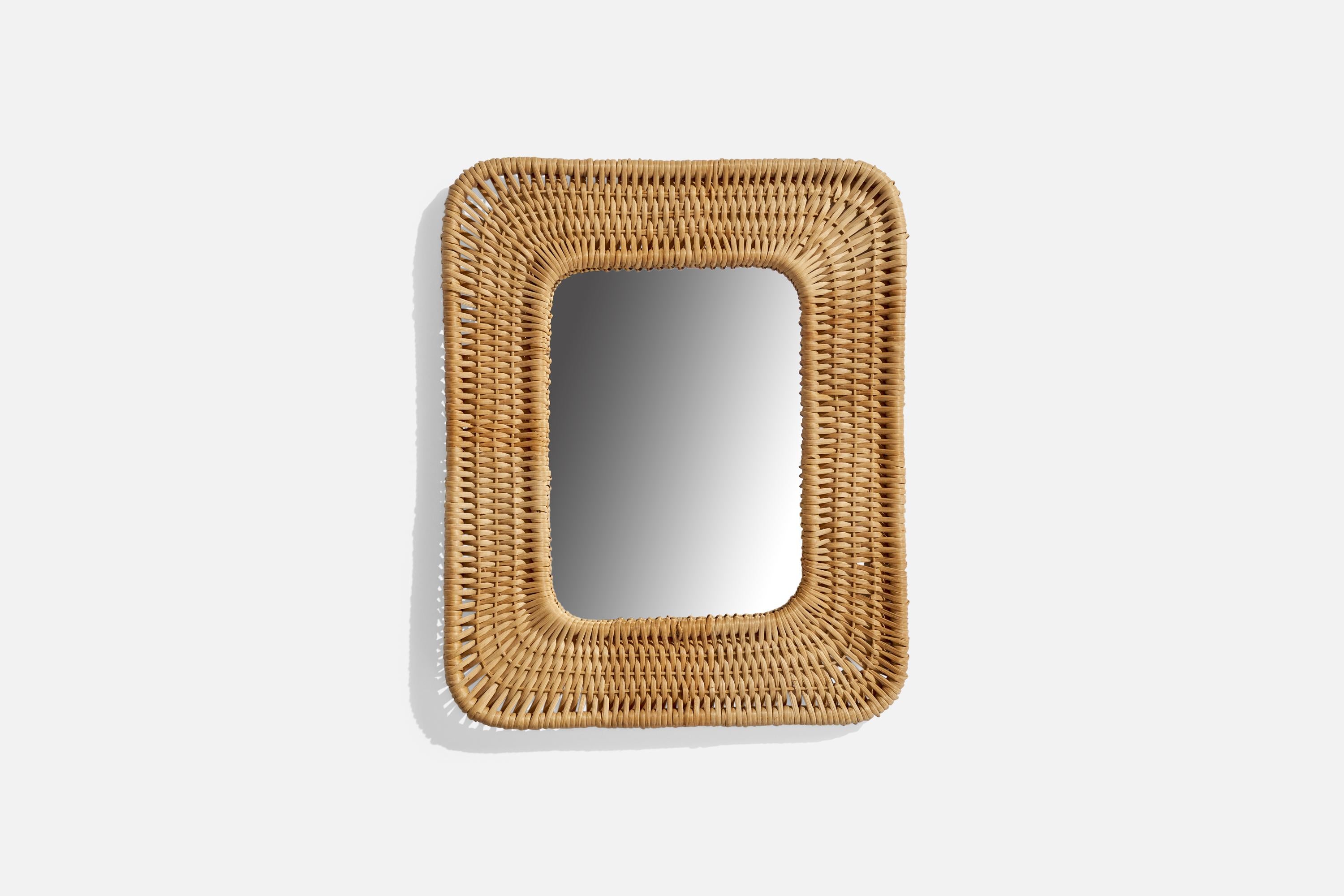 A woven rattan wall mirror designed and produced in Sweden, 1970s.