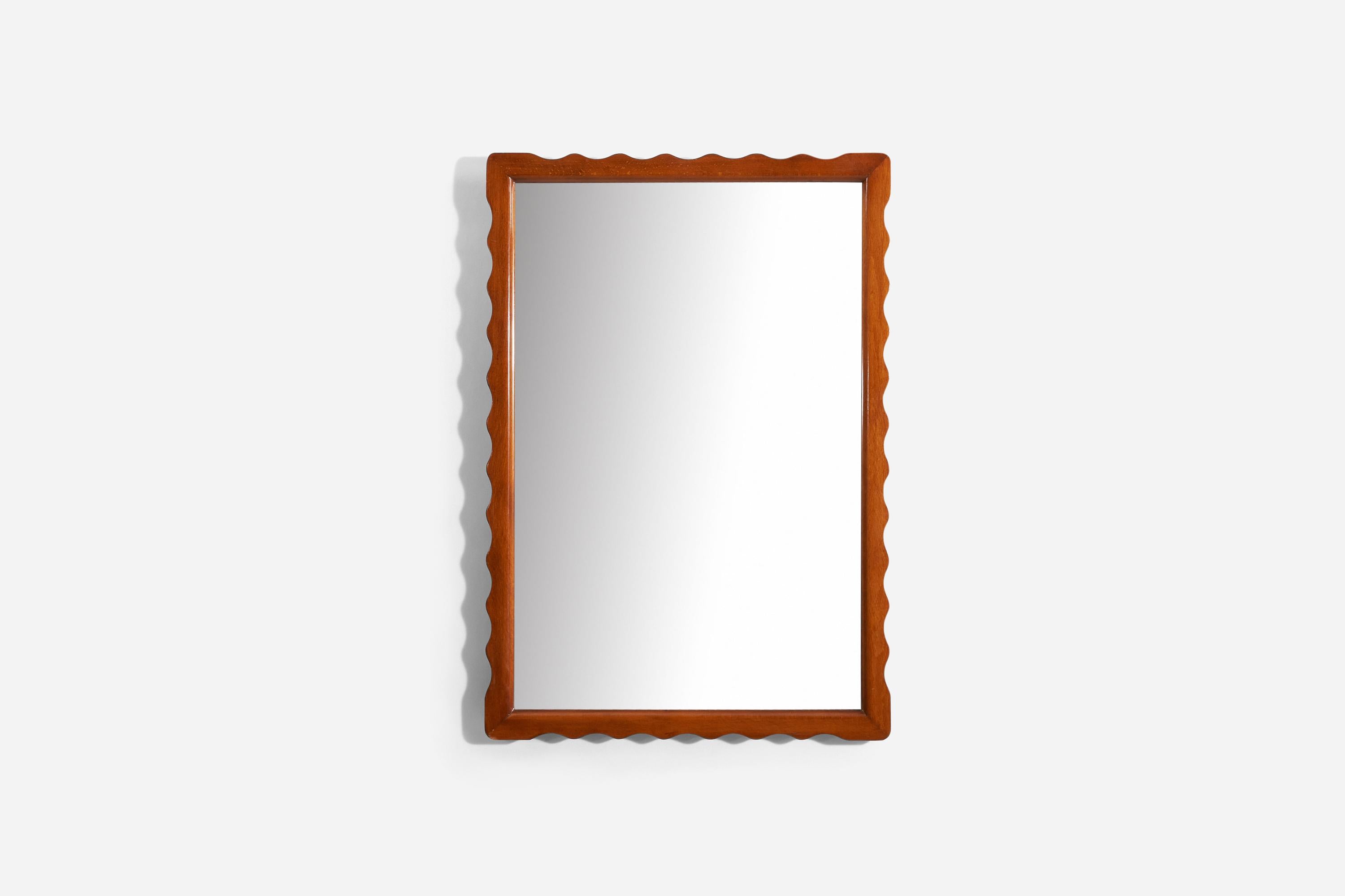 A carved solid wood frame mirror, designed and produced in Sweden c. 1940s.