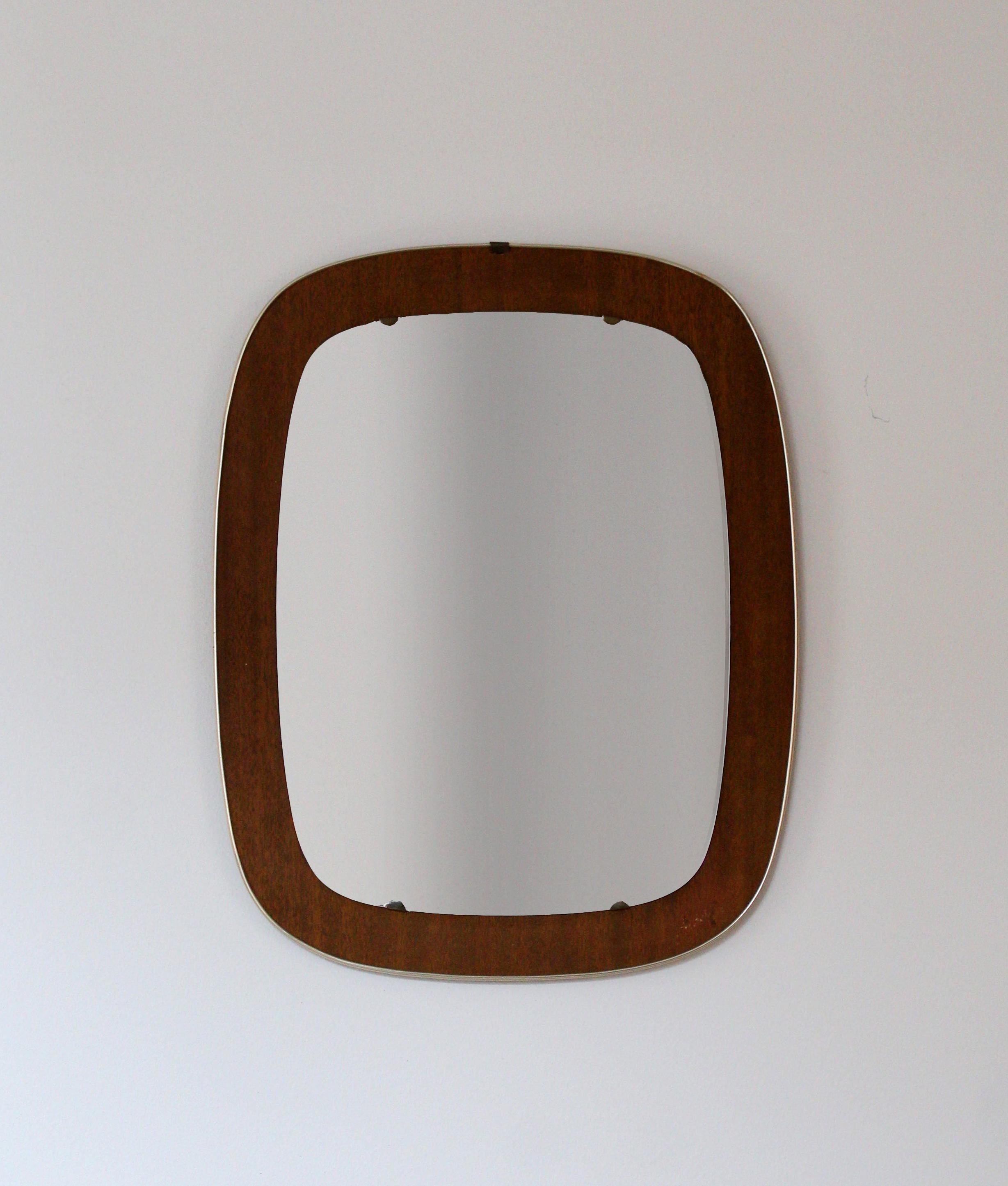 A wall mirror. Designed and produced in Sweden, 1950s. In teak, metal, and mirror glass. 

Other designers of the period include Fontana Arte, Max Ingrand, Josef Frank, Campo & Graffi, and Line Vautrin.