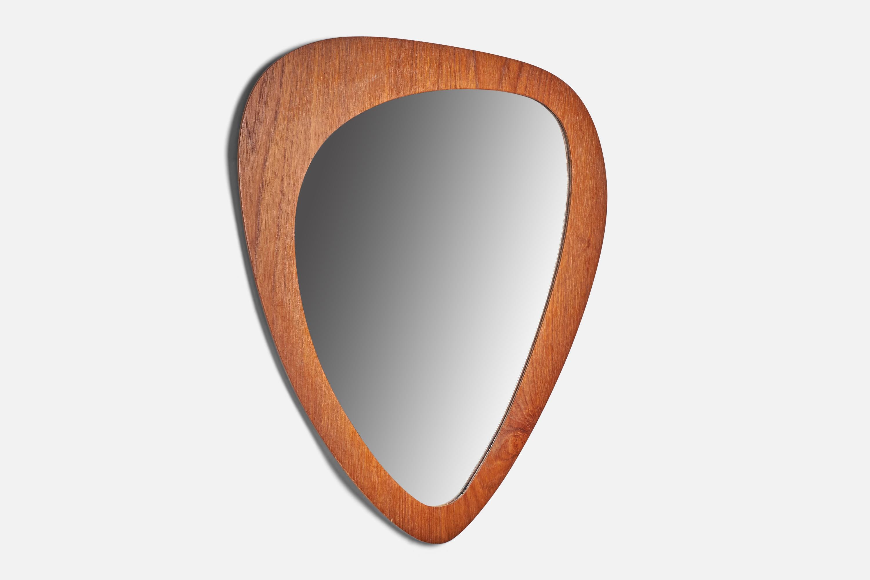 A thin teak veneer freeform wall mirror designed and produced in Sweden, 1950s.