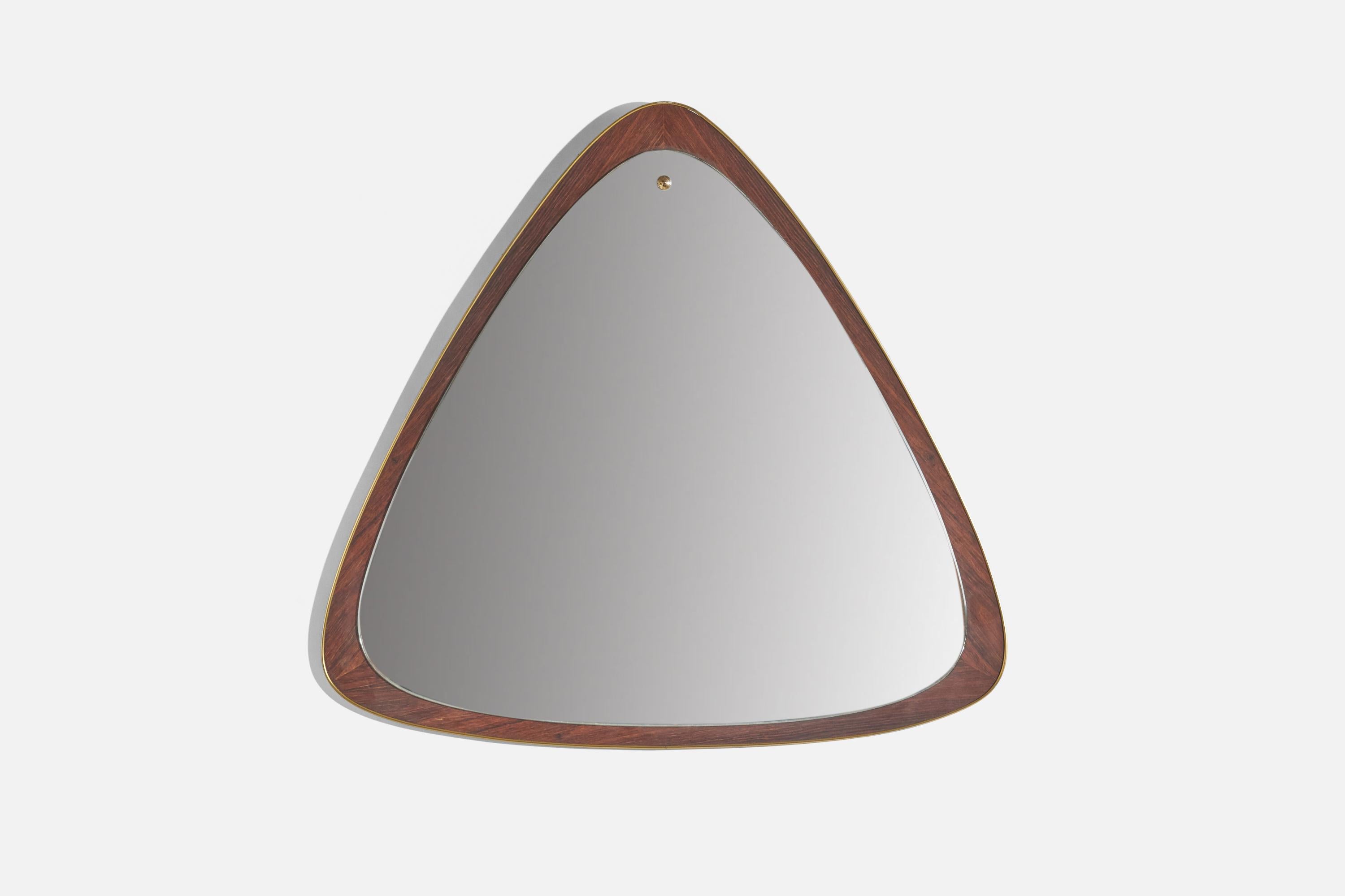 A walnut and brass wall mirror designed and produced in Sweden, 1950s. 


