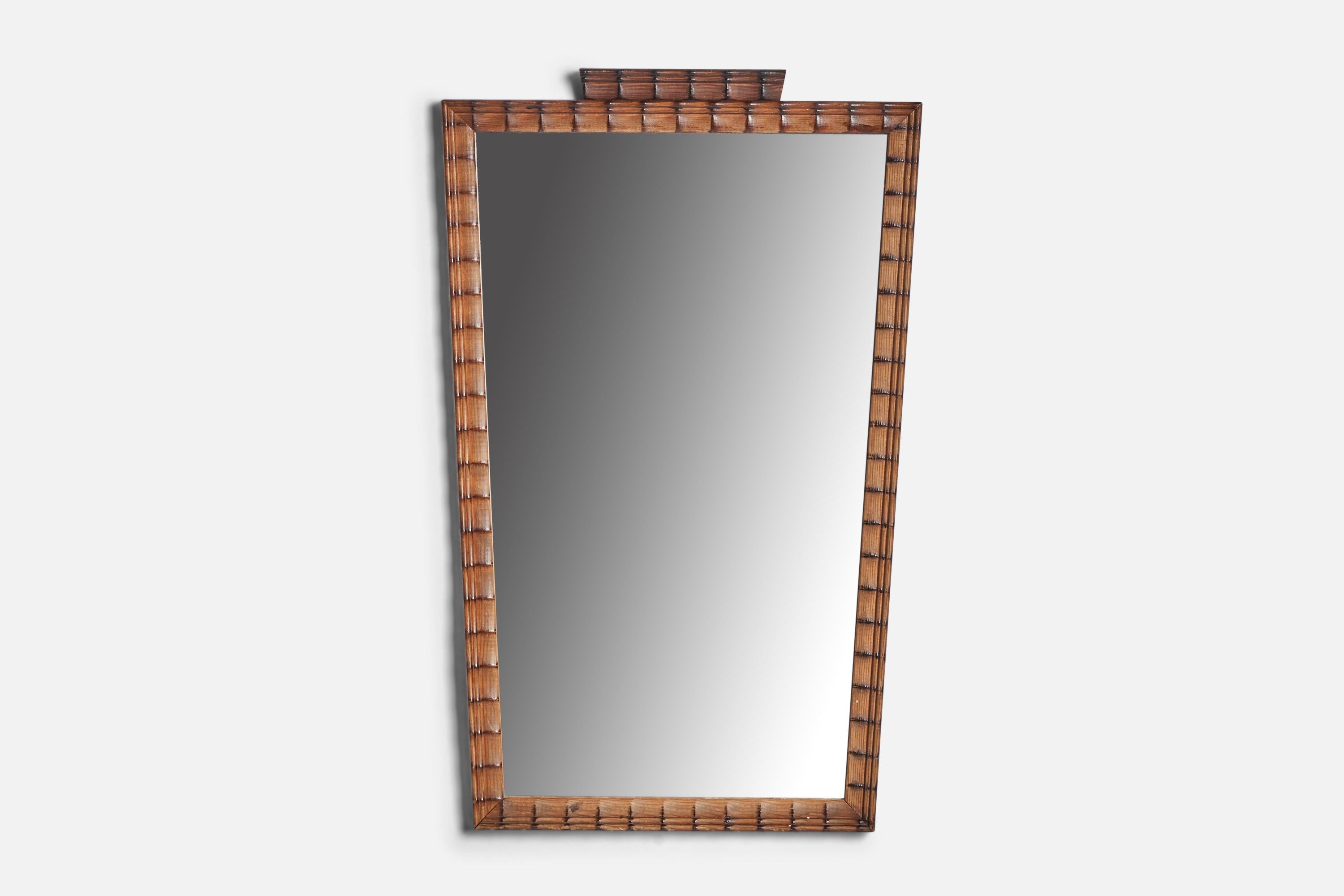 A wood wall mirror designed and produced in Sweden, 1940s.
