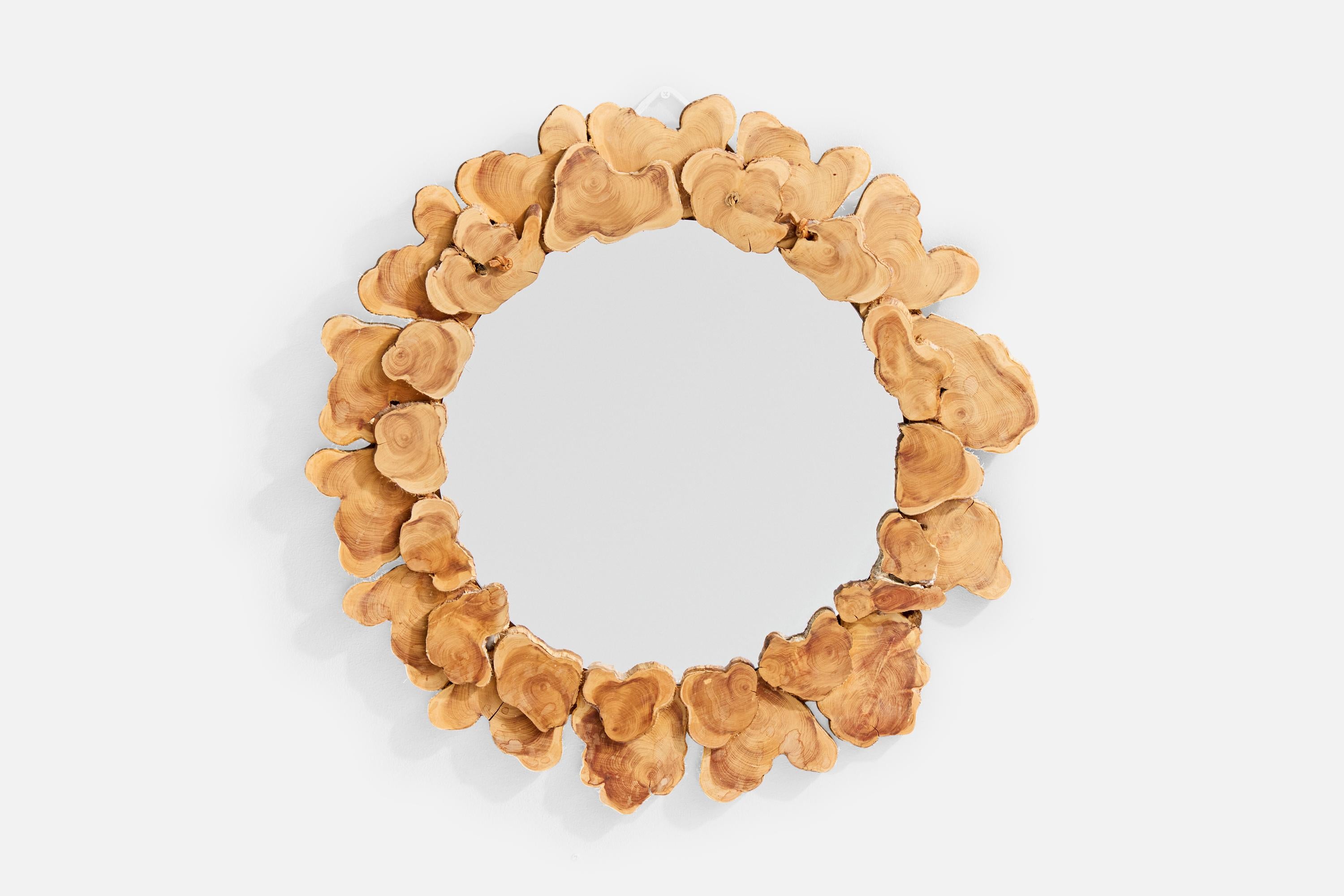 A cut wood branch wall mirror designed and produced in Sweden, signed and dated 1985.

Overall Dimensions (inches): 18.25