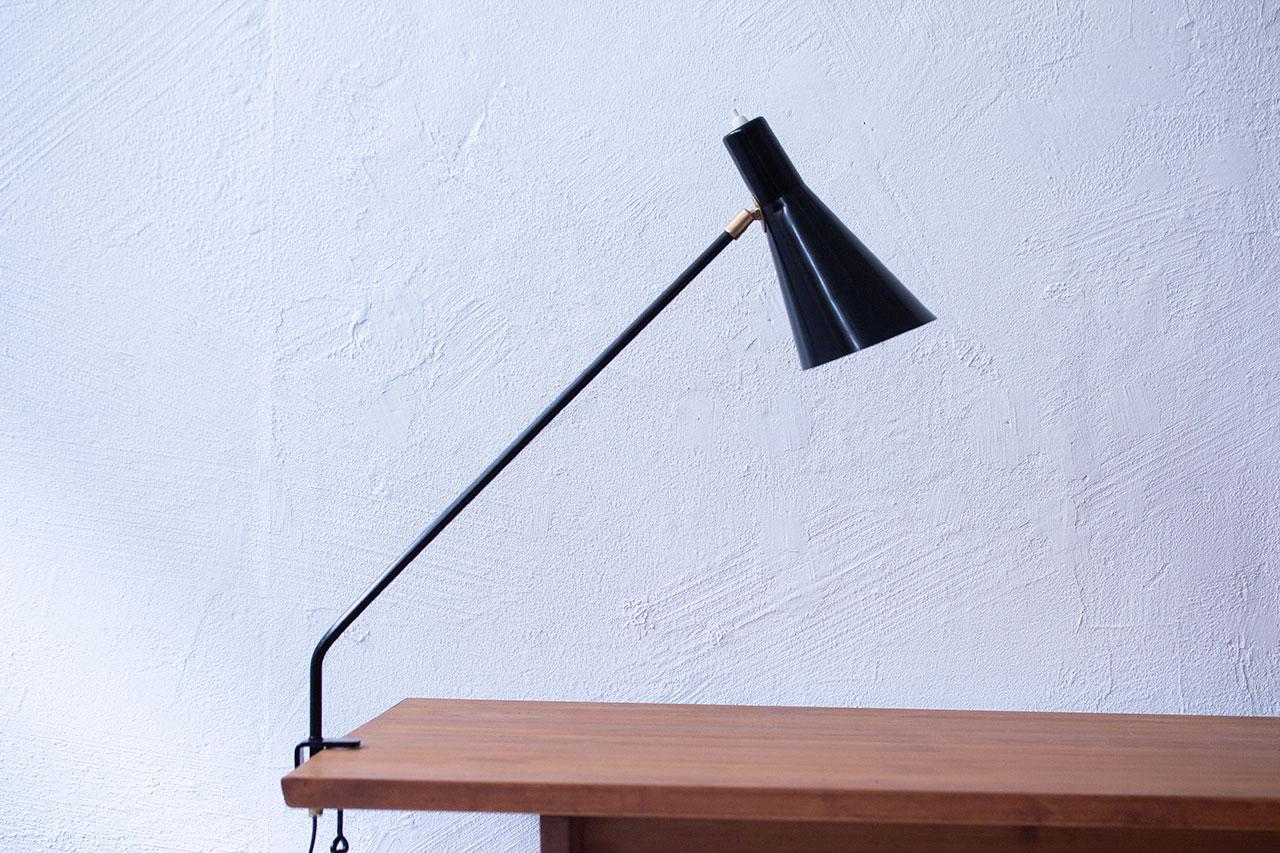 Desk clamp lamp  designed by Alf Svensson,
manufactured by Bergboms in Sweden during
the 1950s.  Made from steel with aluminum
shade and brass joints.