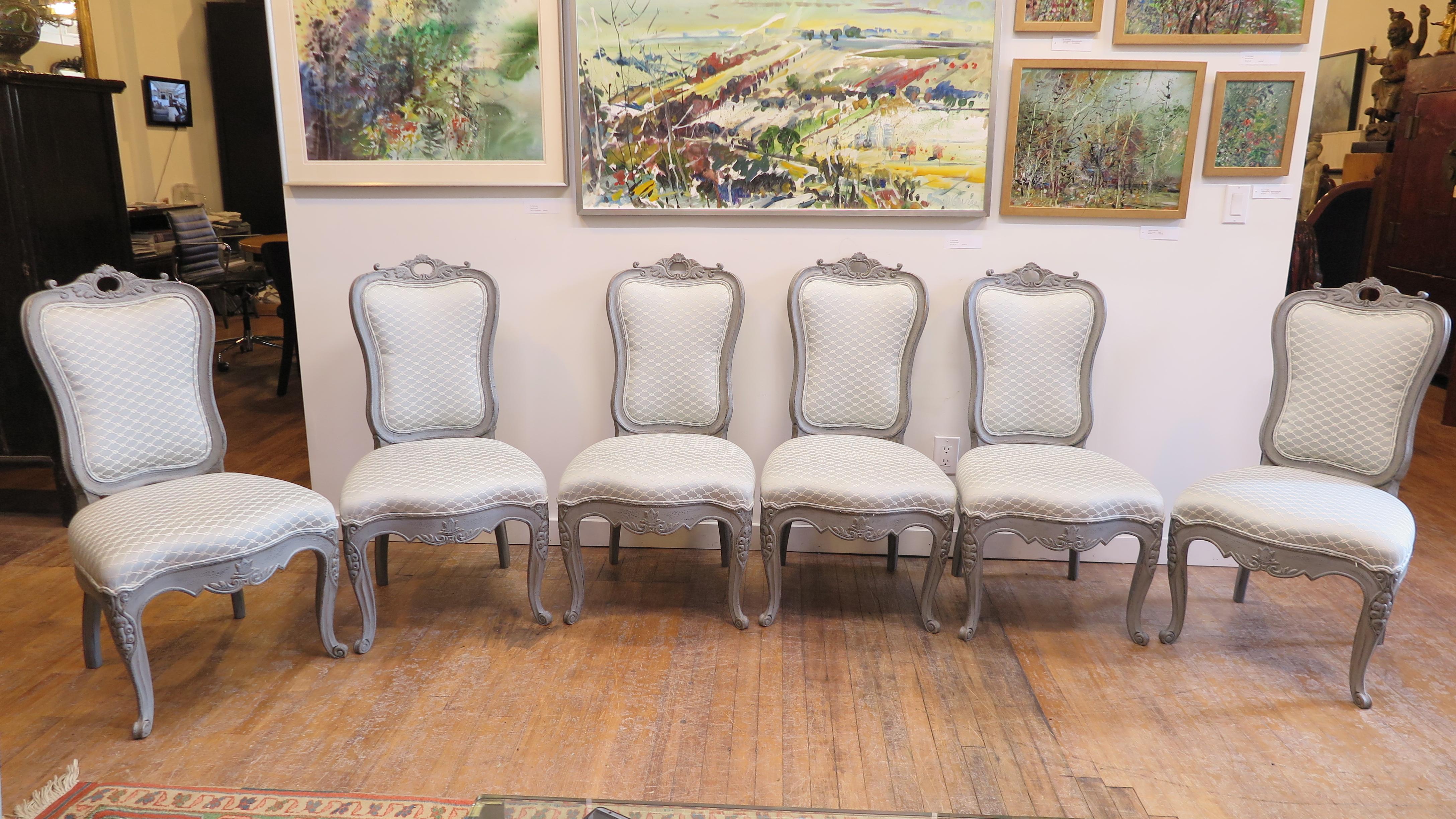 Antique Swedish Gustavian style dining chairs. Nicely carved with curved backs, very comfortable. Upholstery is good condition and can be placed as is, cushions are firm with very good support, backs and seats. Chairs are solid wood and in solid and