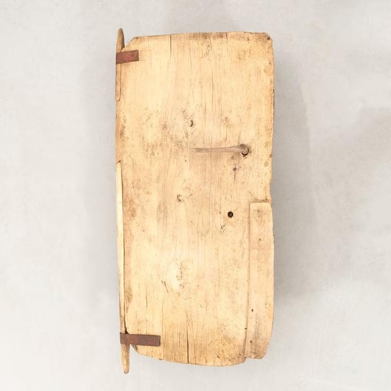 Antique 19th-Century Wooden Door – A Primitive Statement Piece
This 19th-century wooden panel door is a striking example of historical craftsmanship. Its weathered surface, marked by natural cracks, wear, and worming traces, adds an authentic