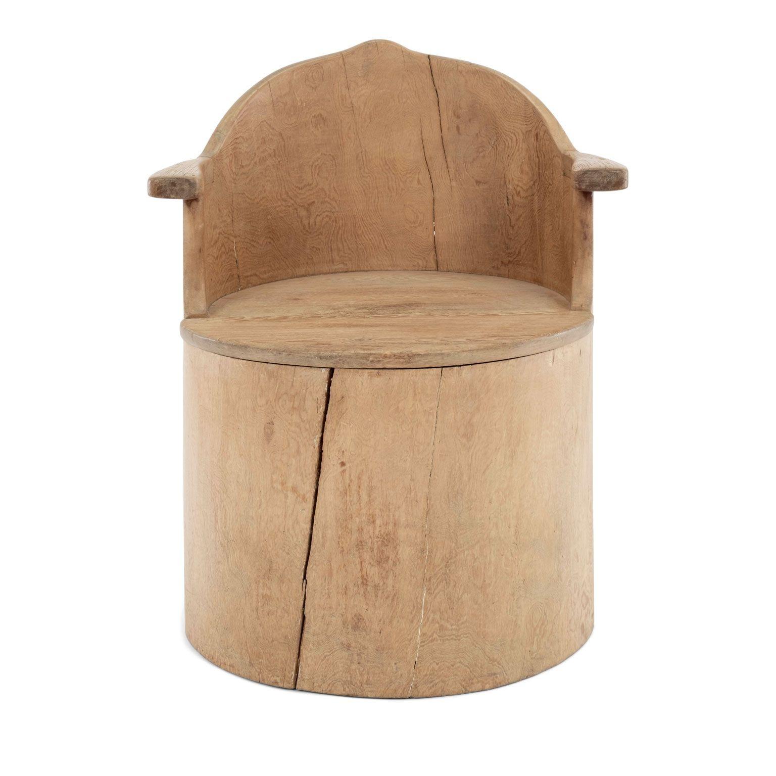 Swedish dug-out chair, or kubbestol, circa 1910. Traditional Scandinavian folk art chair made from a log, from central Sweden. Rustic fruitwood barrel-shape body with arms and seat from pine. All hand-carved. Nice dry, pale patina and finish.