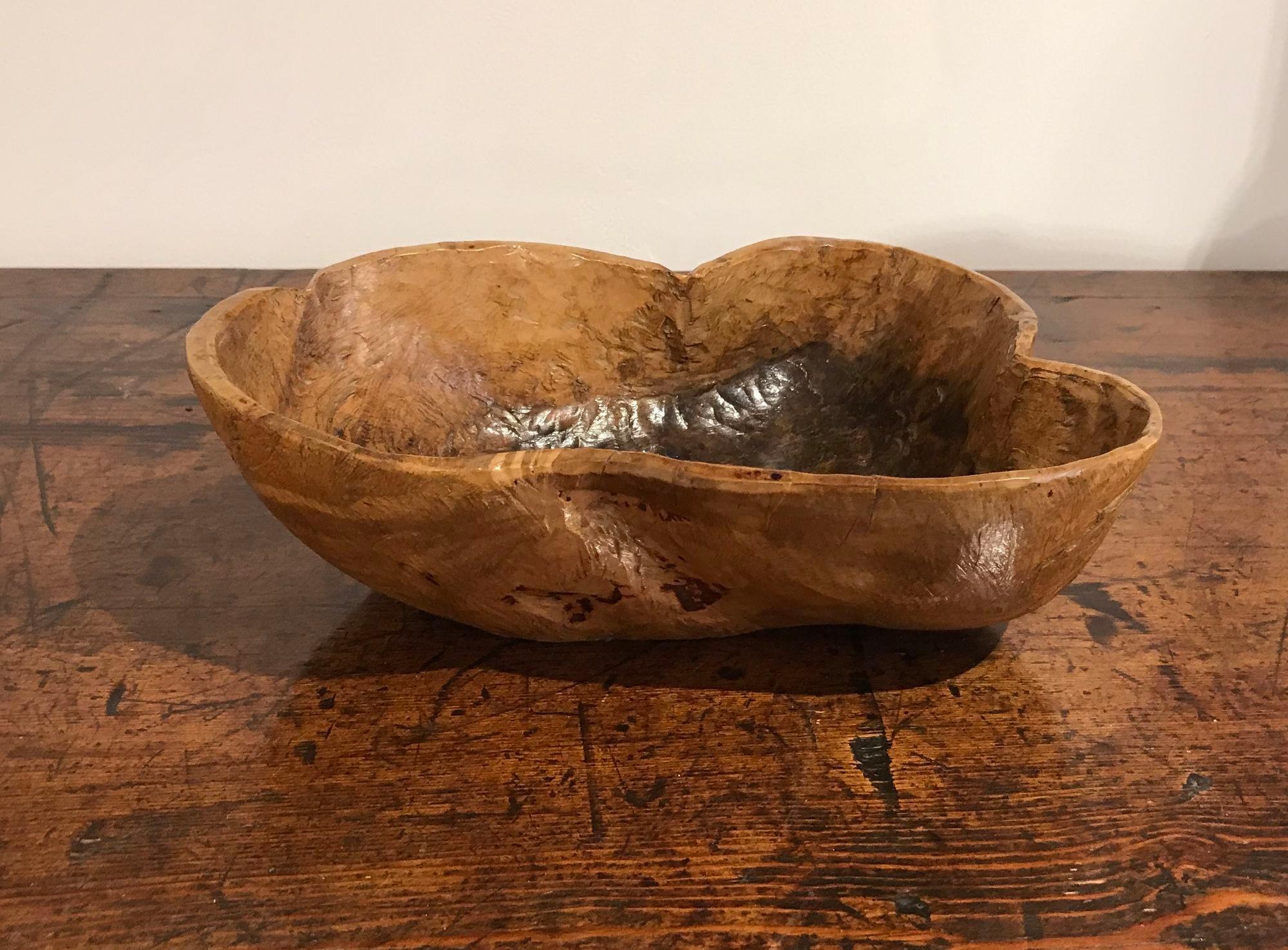 fine Swedish early 19th century birch root burl bowl of organic form and having a rich patina and unusual shape, the interior with black discoloration often associated with ale bowls.
Burls, the natural occurring growths found on many trees, are