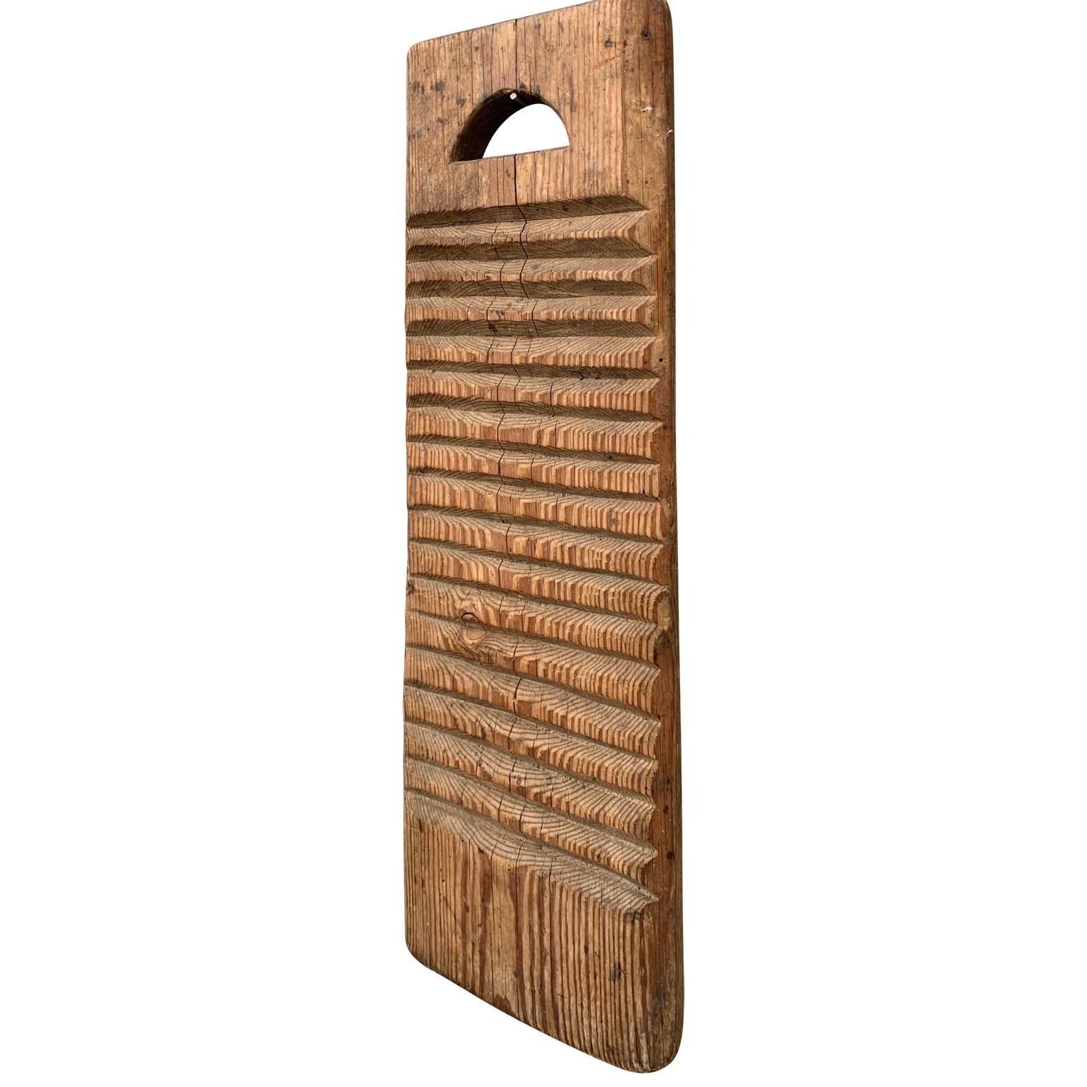 A Swedish washboard in pine dated 1830 with owner initials 