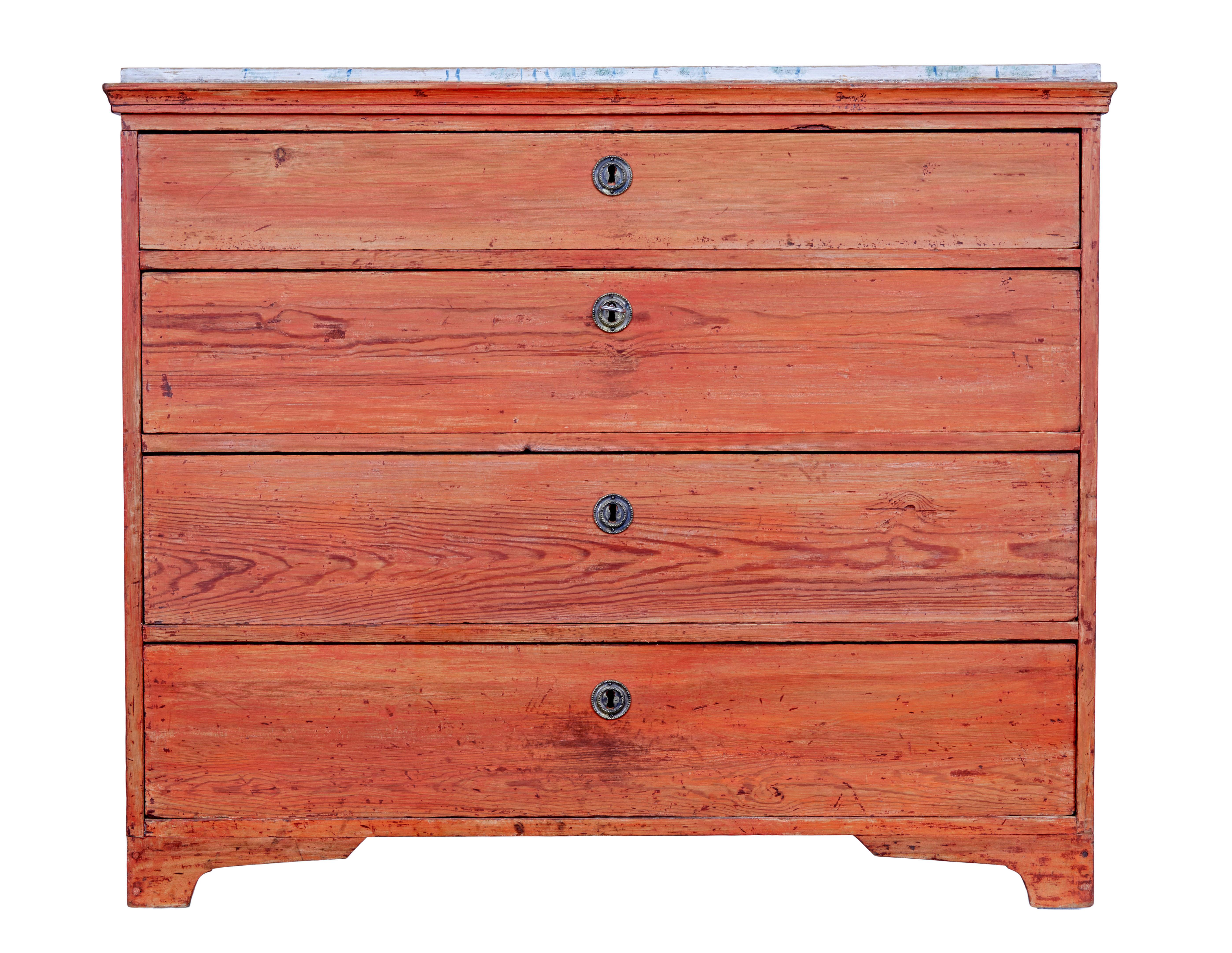 Swedish early 19th century painted pine chest of drawers circa 1800.

Fine quality chest of drawers, fitted with 4 graduating drawers that open on the key.  Bold red paint that has worn through, now showing the grain of wood underneath.  Contrasting