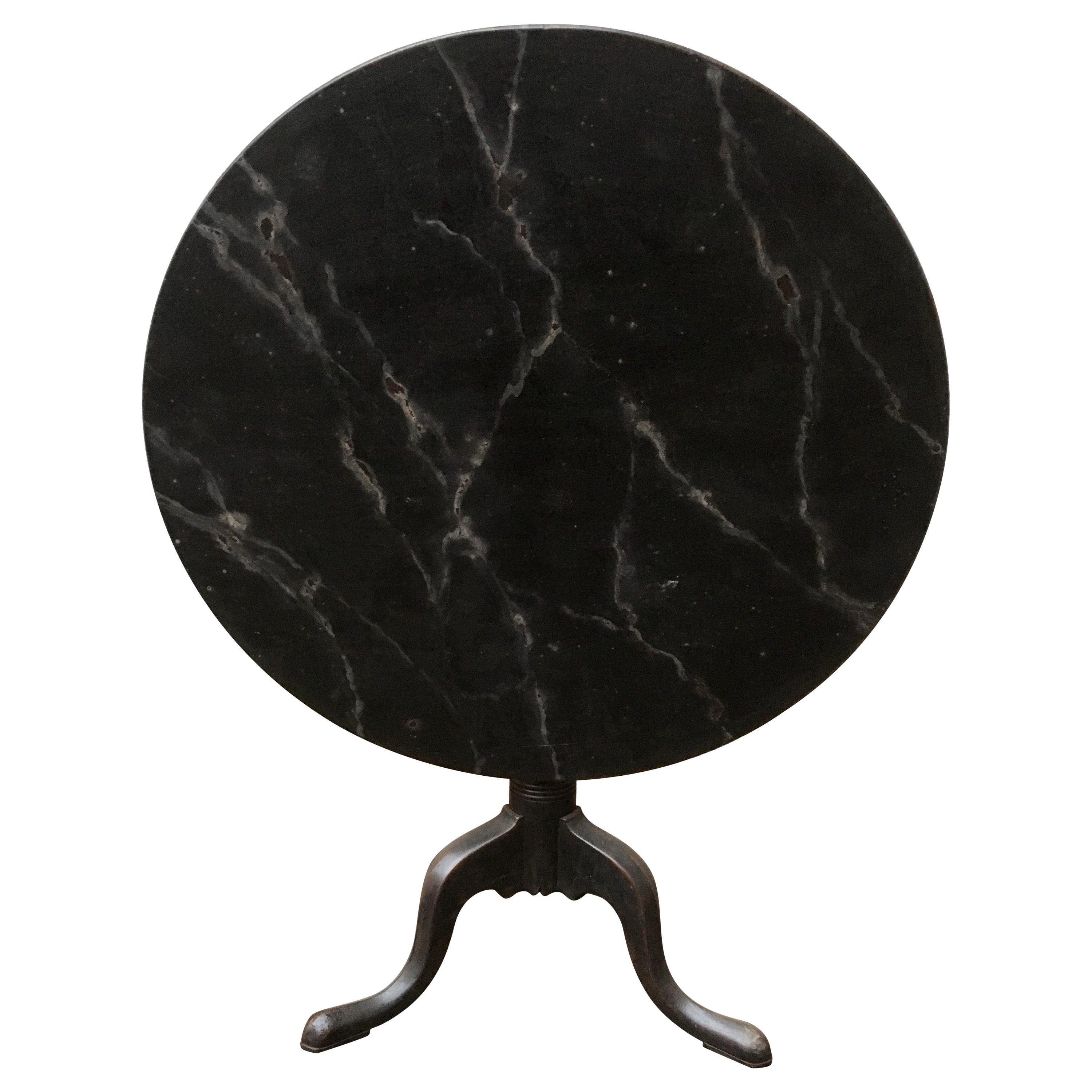 A Swedish faux marble painted tilt top table. 
From early 19th century Gustavian period and with a very decorative later painting that follows the Scandinavian tradition of painted furniture.



 