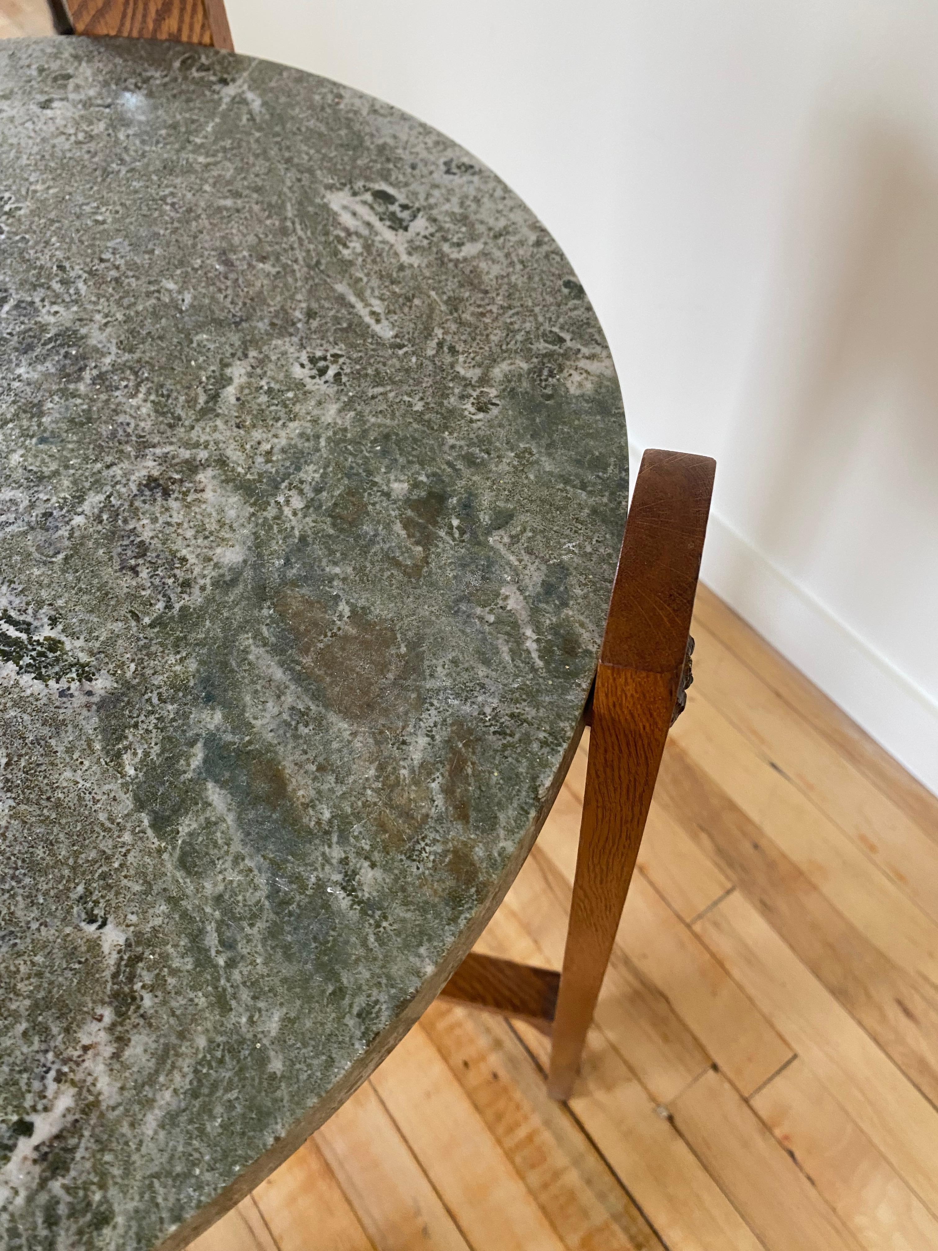 Circa 1910s Swedish Oak and Stone Side table. Decorative metal decorations on each leg and a beautiful green shaded stone top. The cross leg design is typical for early Swedish Art Nouveau design. In a very good condition.

Dimensions: H 26.75 x D