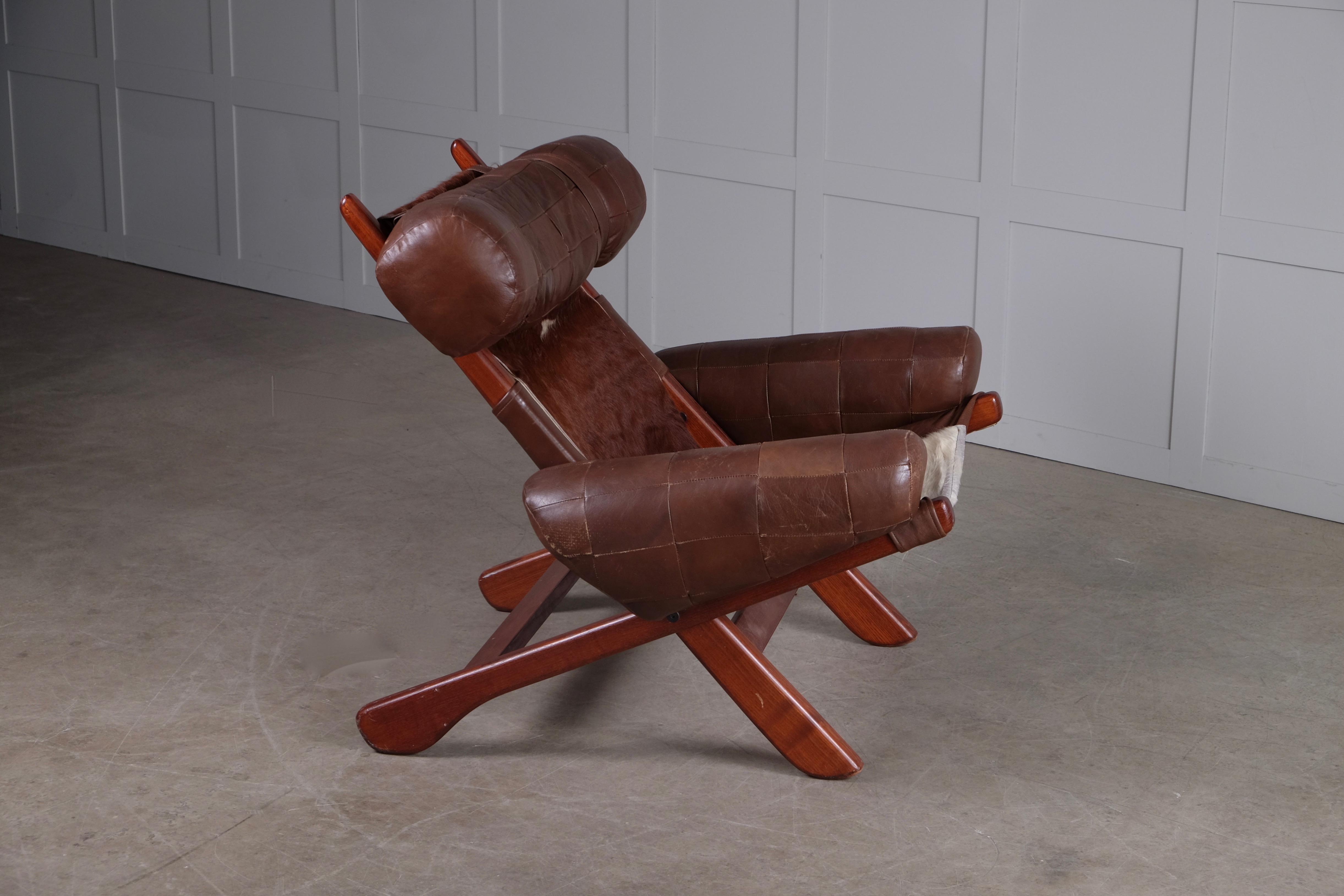 Produced in Sweden, 1970s. Attributed to Arne Norell.
Dark stained beech and leather.