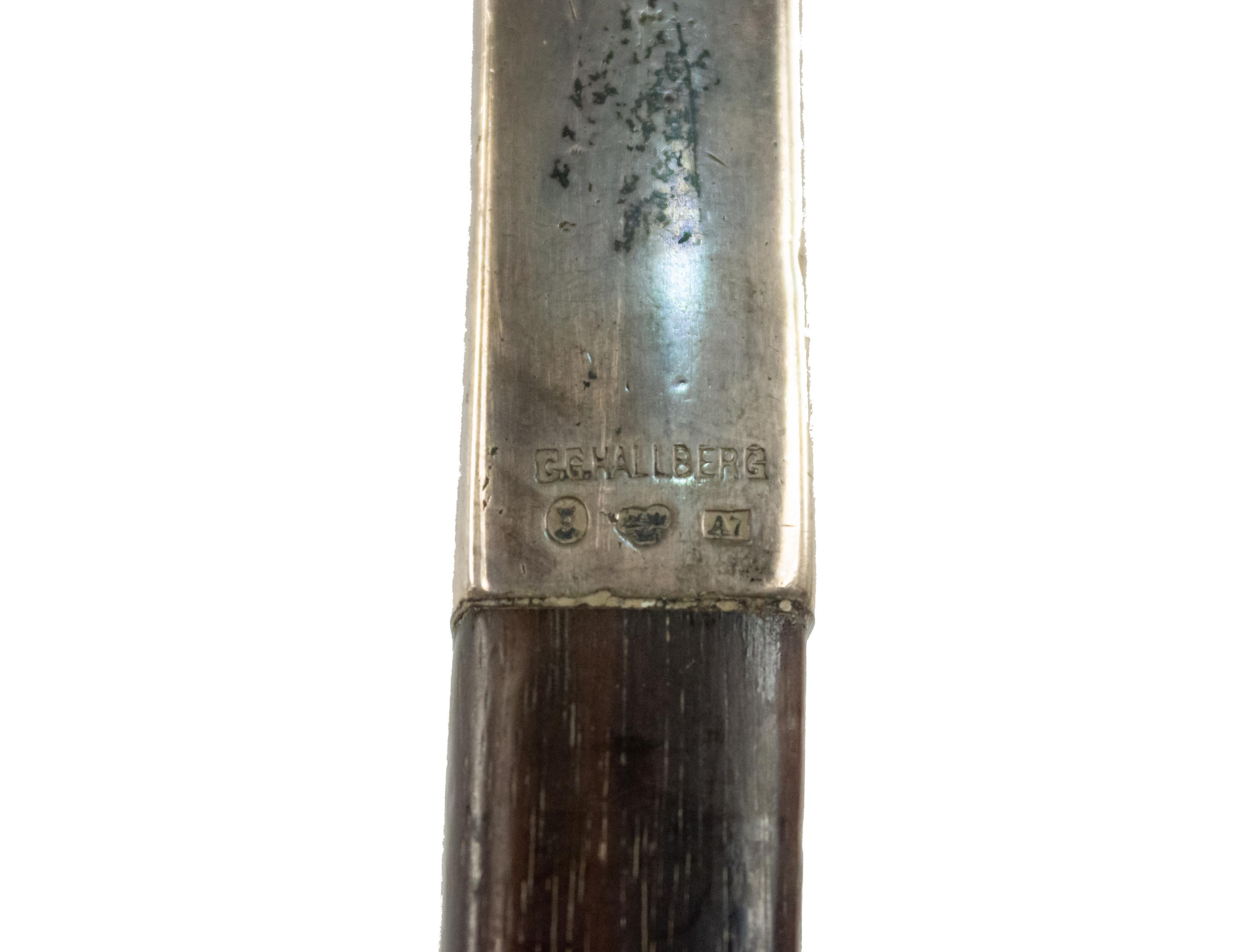 Swedish Edwardian ebony square shaped cane with simple silver handle. Hallmarks on handle with C. G. Hallberg stamp. Engraved name of prior owner at handle in script.