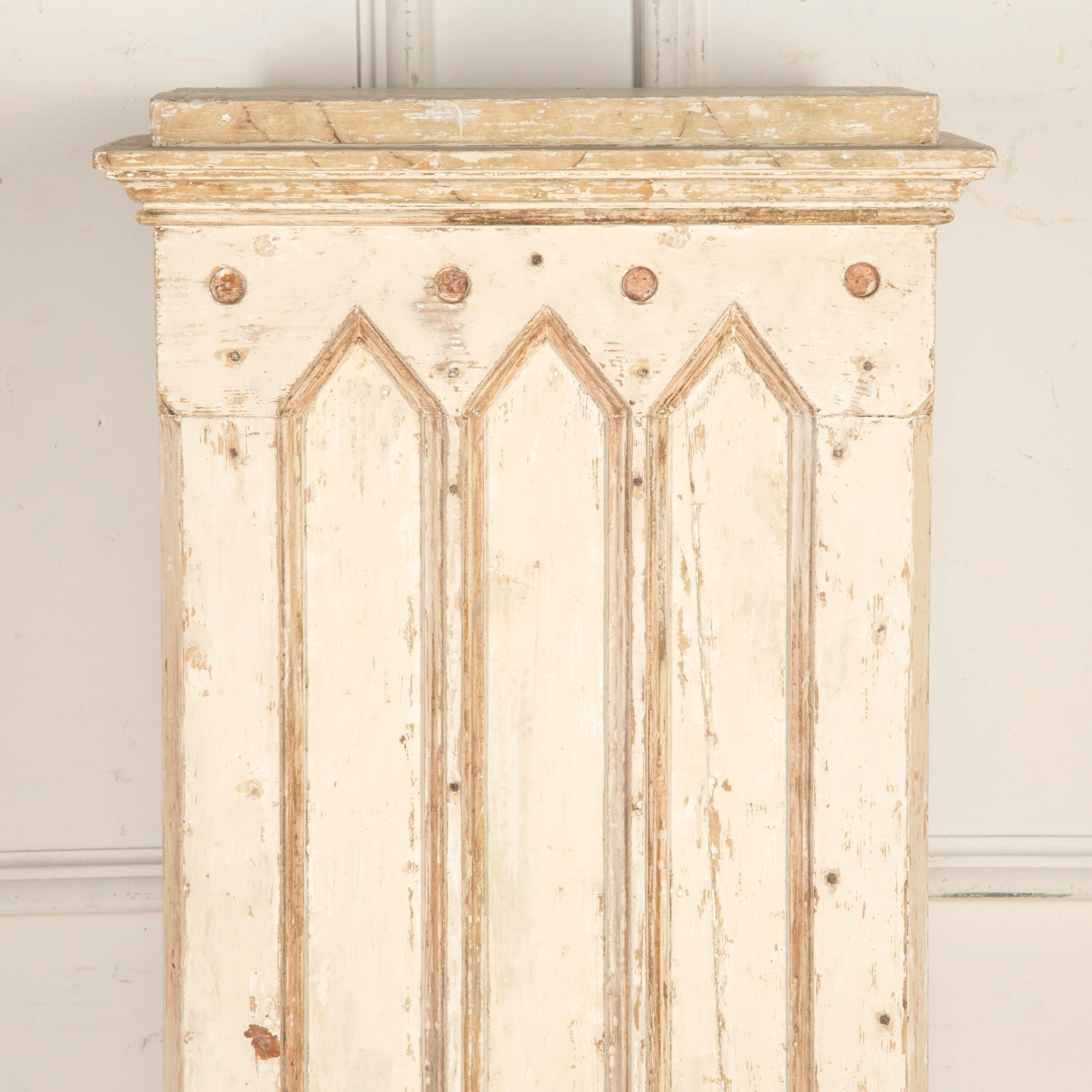 Large Swedish Empire early 20th Century column pedestal. 

This wonderful neoclassical pedestal features a moulded faux marble top over the main shaft with arched and recessed panels and roundels. Resting on a substantial stepped base. 

This