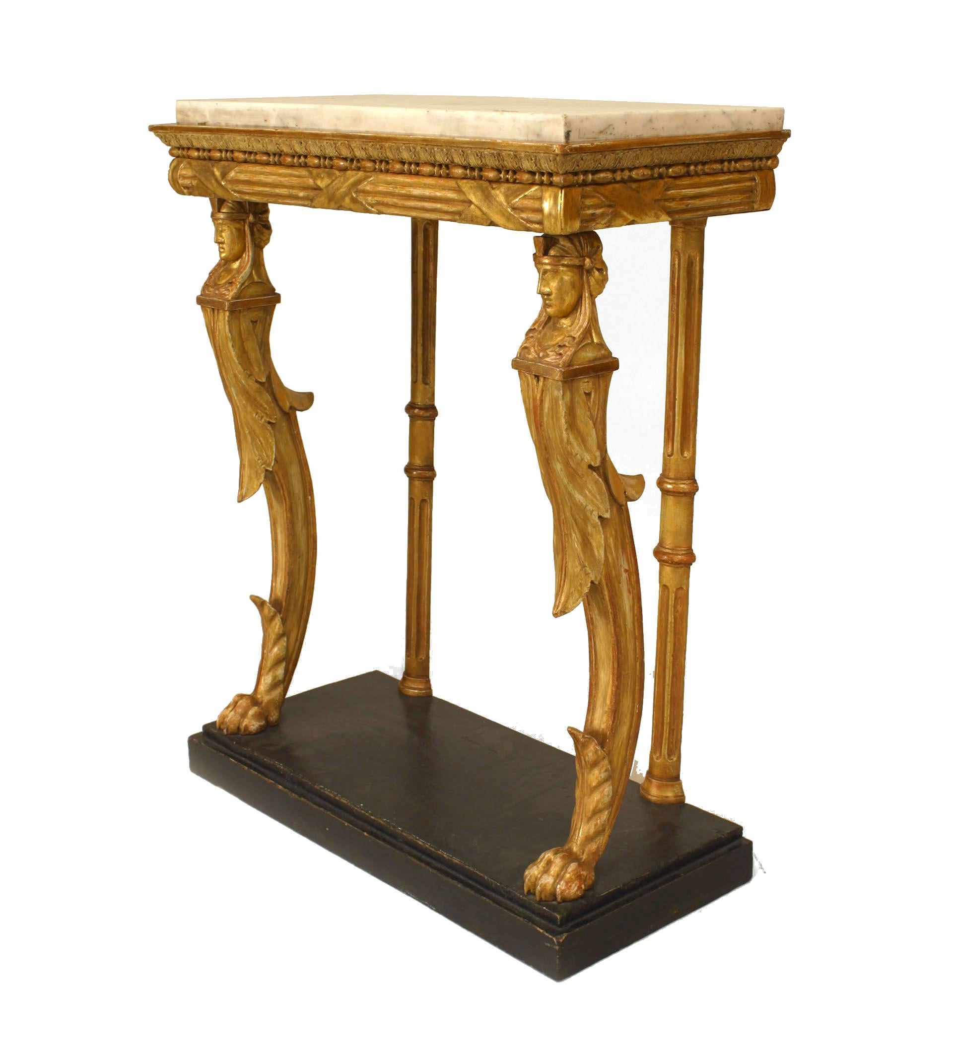 This narrow console features gilt sphinx legs and trim, a white inset marble top, and a faux marble wood platform base.