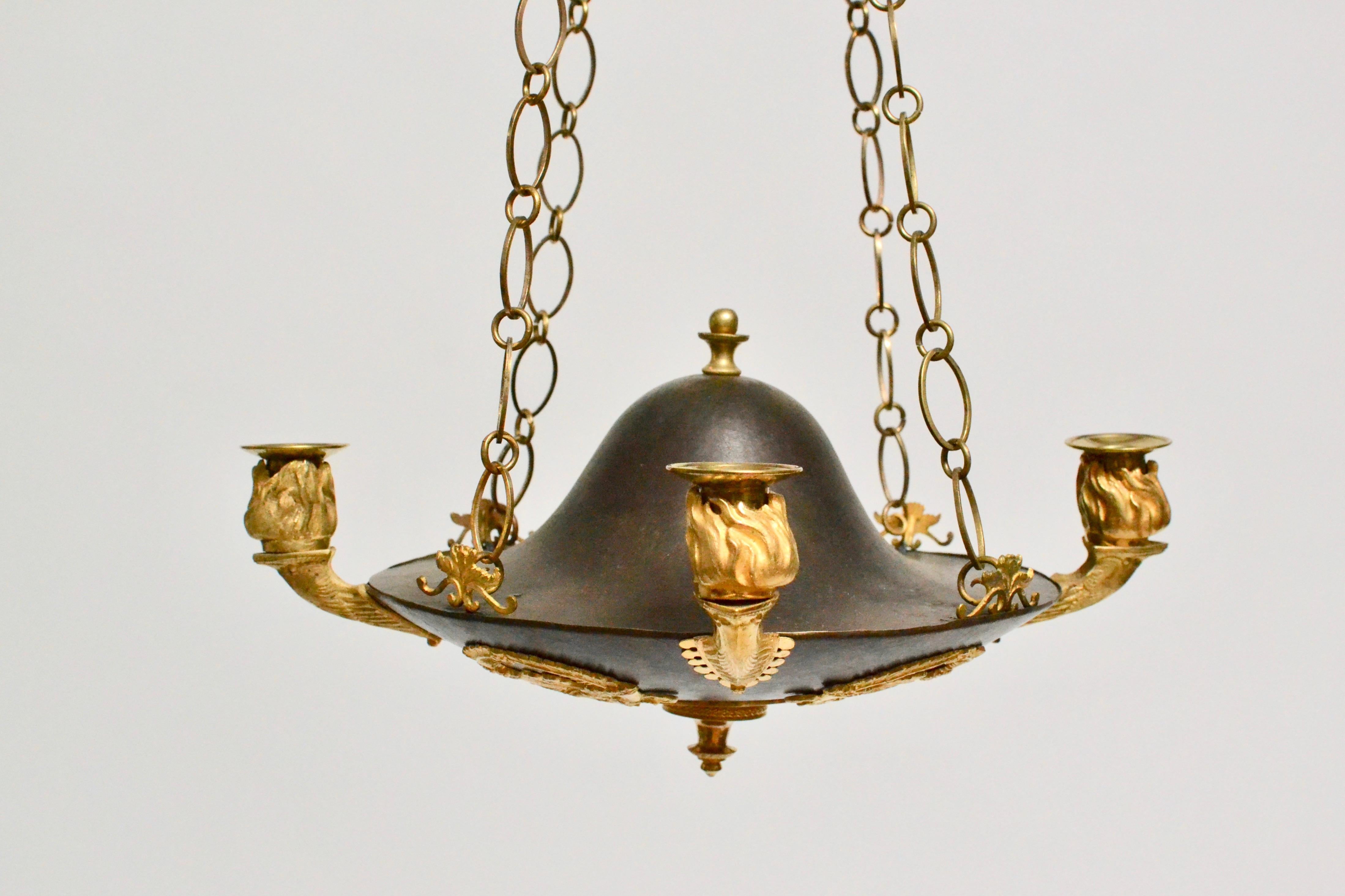 A Swedish Empire gilt and patinated bronze chandelier made, circa 1810-1820.