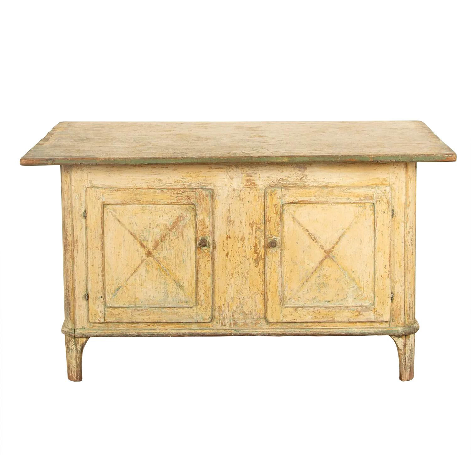 Swedish Empire workbench with fine patina. This is a useful piece of storage furniture with two cupboards to the front and two drawers to the side, the top surface sits directly in the middle of the counter so would make an excellent room divider,