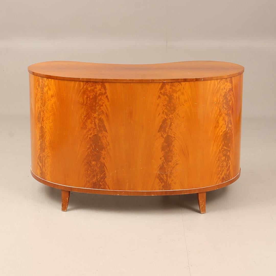 A mid 20th century birch art deco desk with 7 drawers and key included. 
Date of manufacture stamped: 20 12 1940
Designed by Erik Chambert (1902-1988) who was a pioneering interior designer and furniture maker. He co-managed Chamberts Möbelfabrik, a