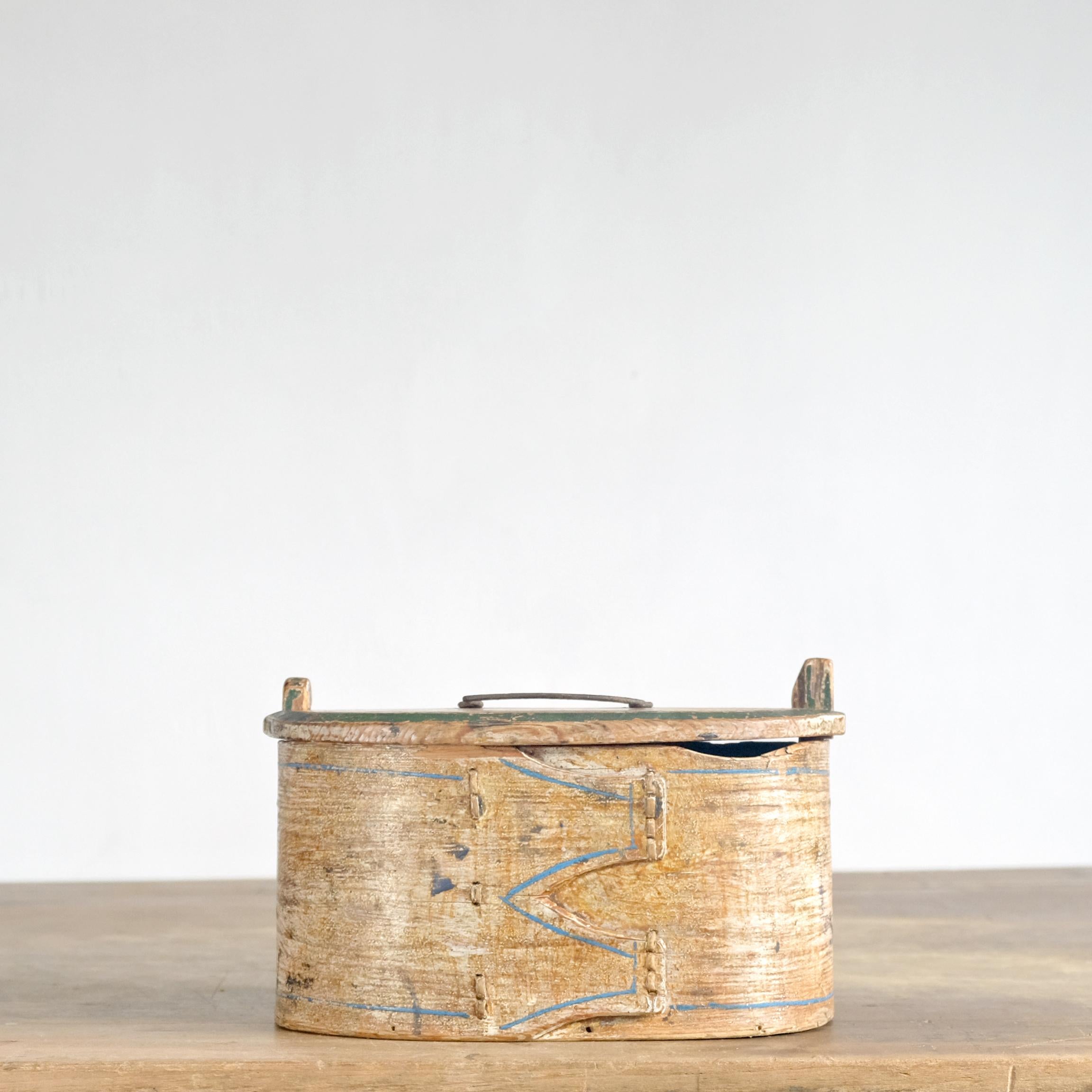 A 19th century Swedish Folk Art bentwood box with its original painted decoration. Used in the 18th and 19th centuries in Scandinavia, these boxes are constructed from a single piece of bentwood, stitched using roots or other natural fibres, with a