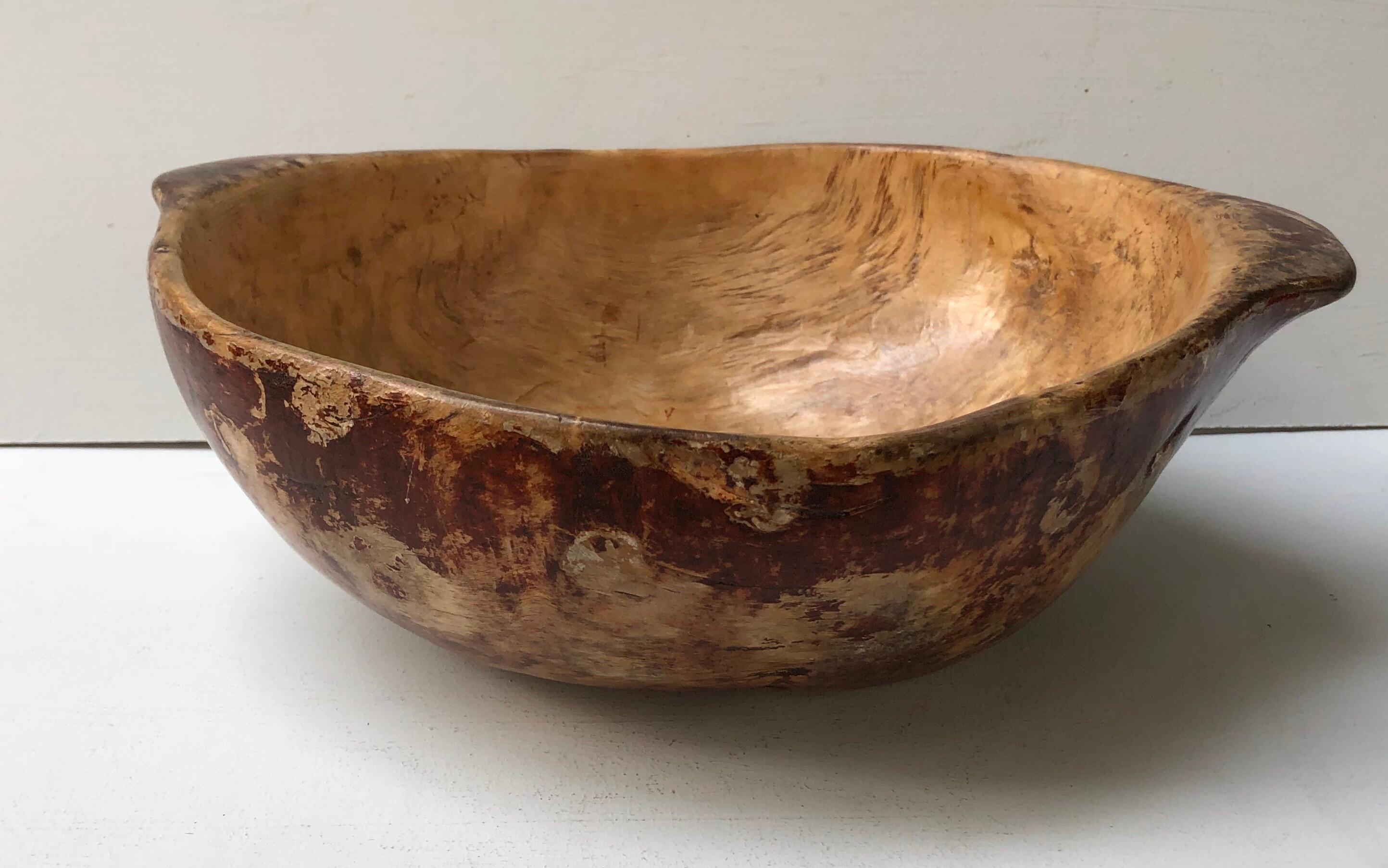 Fine early 19th century Swedish root burl bowl retaining original painted decoration and having several carved and branded owner’s initials on the underside, the whole with excellent patina.