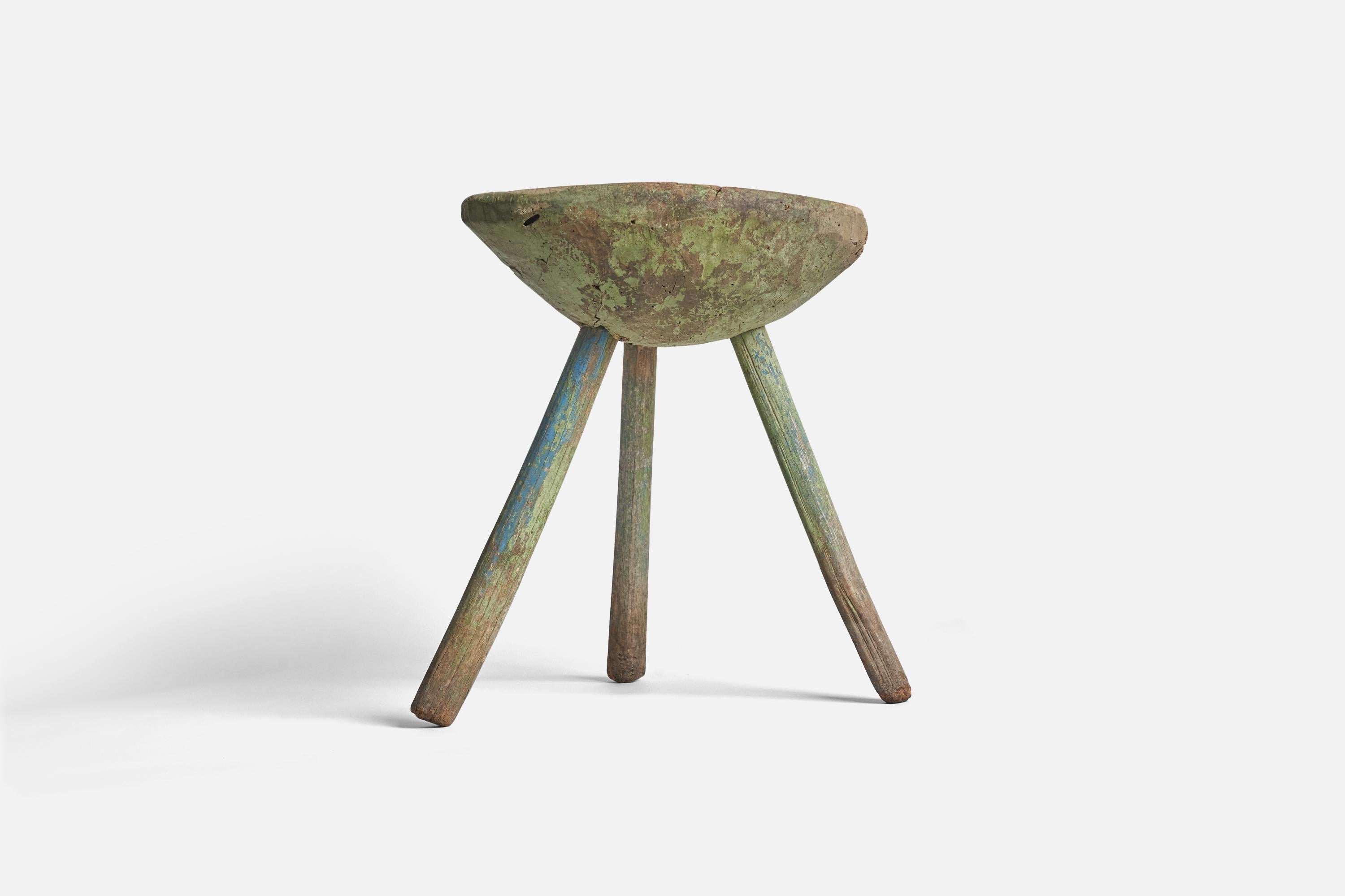 A farmers green-painted wooden stool produced in Sweden, early 19th century. 