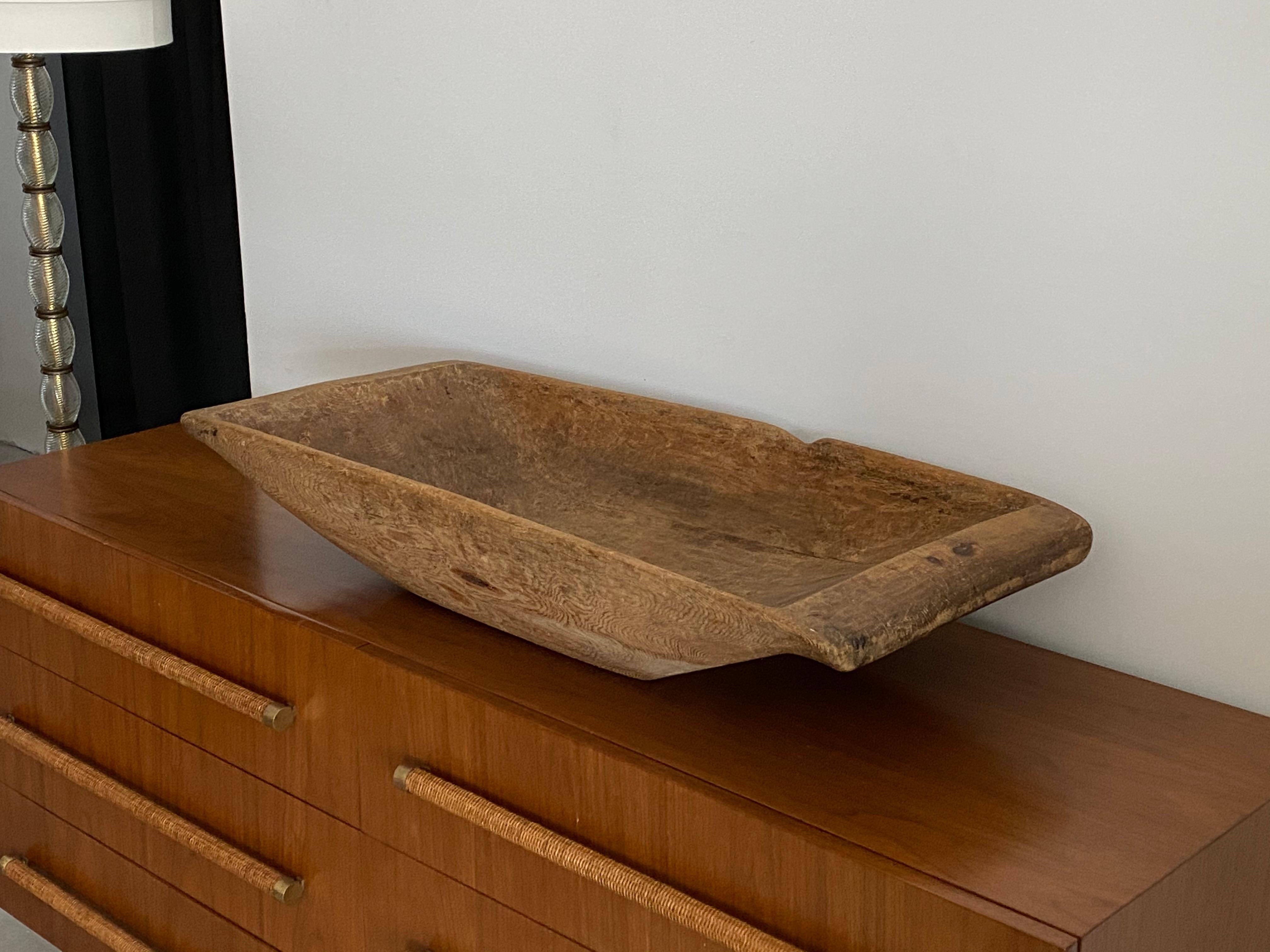A large farmers handcrafted form or tray or serving bowl or centerpiece. In solid pine wood. A highly functional object with a sculptural appearance.

 