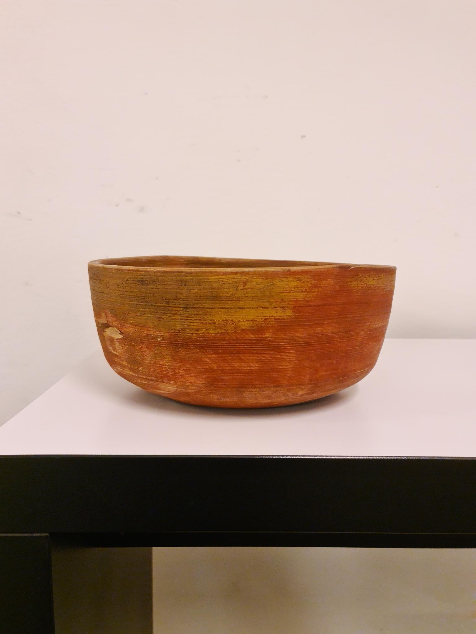 An antique and unique organic wooden bowl. With highly appealing patina, faded painting on the bowl makes this a unique and desirable piece. Produced in Sweden, early 19th century. 
These bowls where especially important for many families;