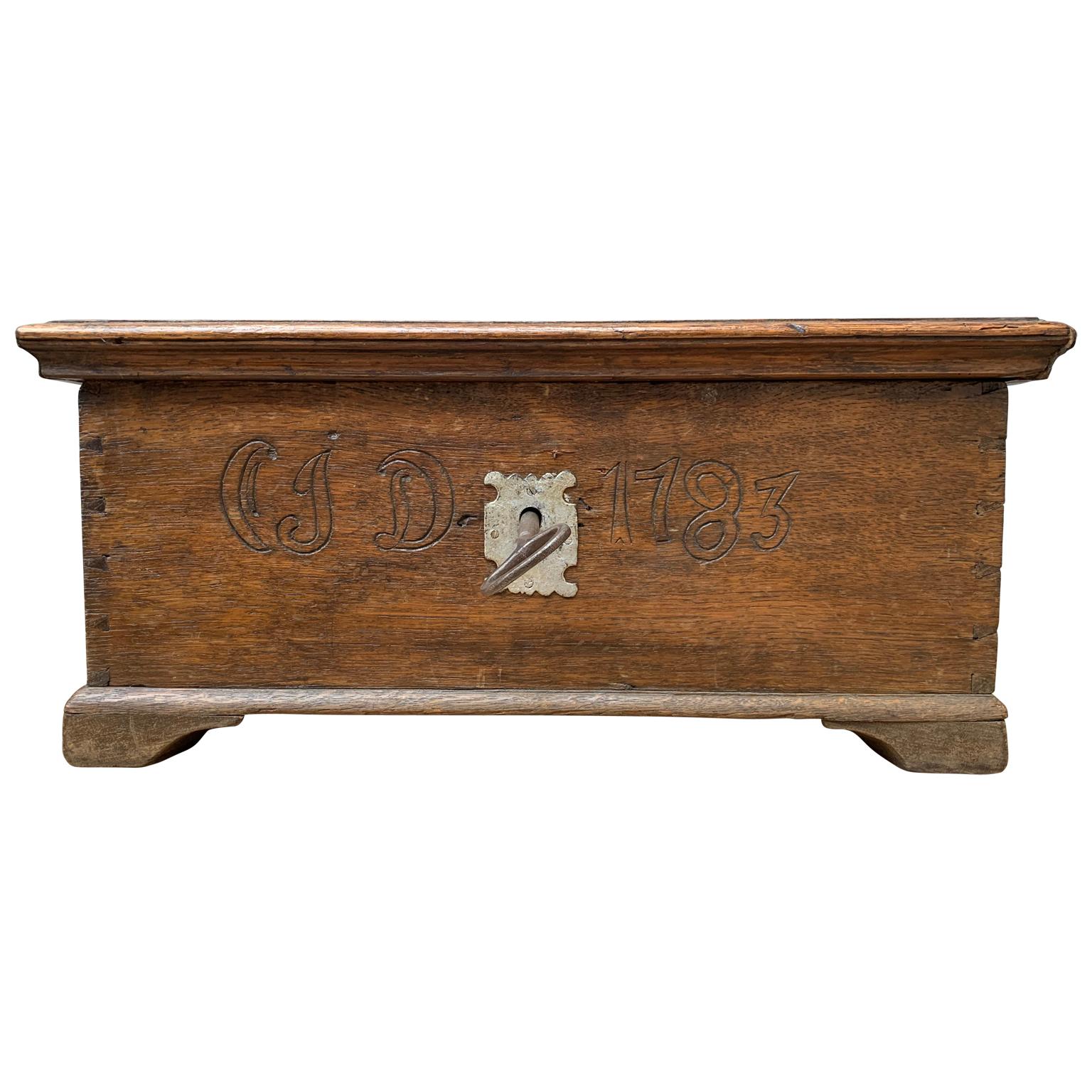 A Swedish oakwood box, dated 1783 and carved with the initial of the girl that received it as a gift (CSD). Most probably as bridal gift from her family. Lock and key original and working (request video).